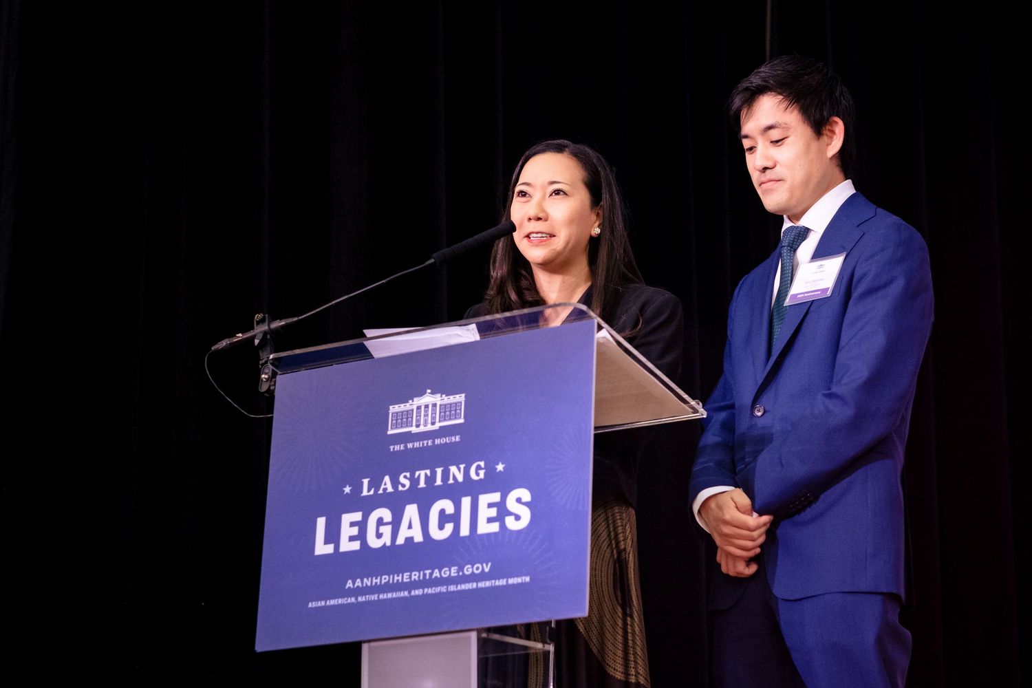 Two speakers present at a Lasting Legacies podium during an official AAandPIHeritage.gov event.