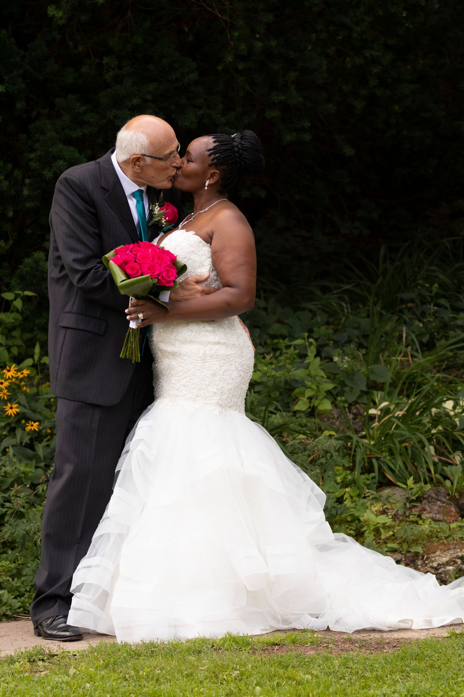 A bride and groom kissing