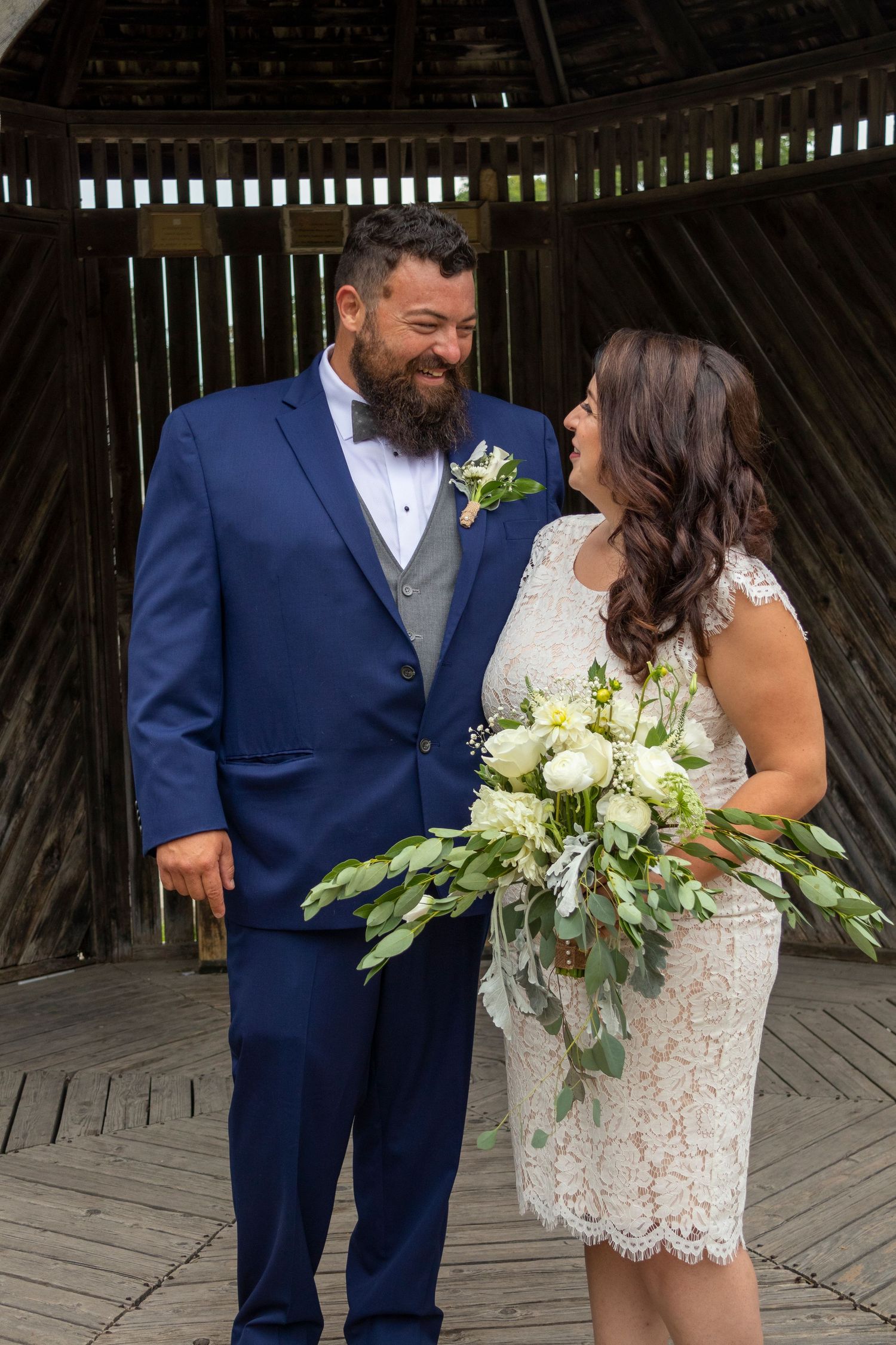 Bride and Groom looking at each other smiling