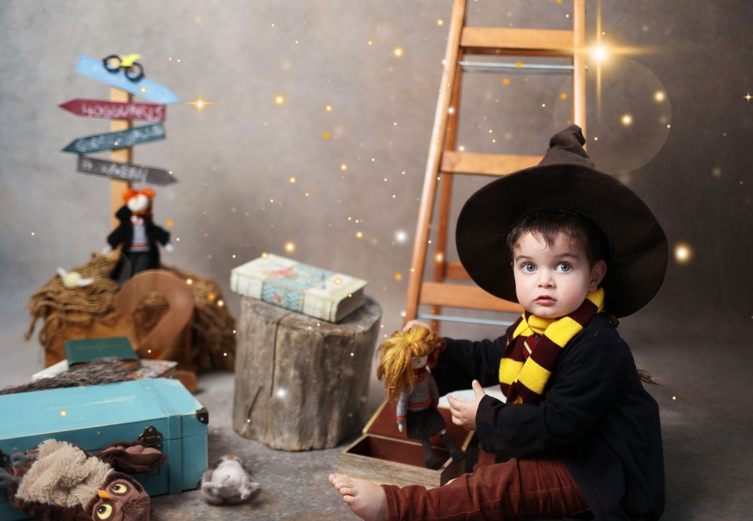 Creative children's portrait with magical lighting and adventure-themed props.