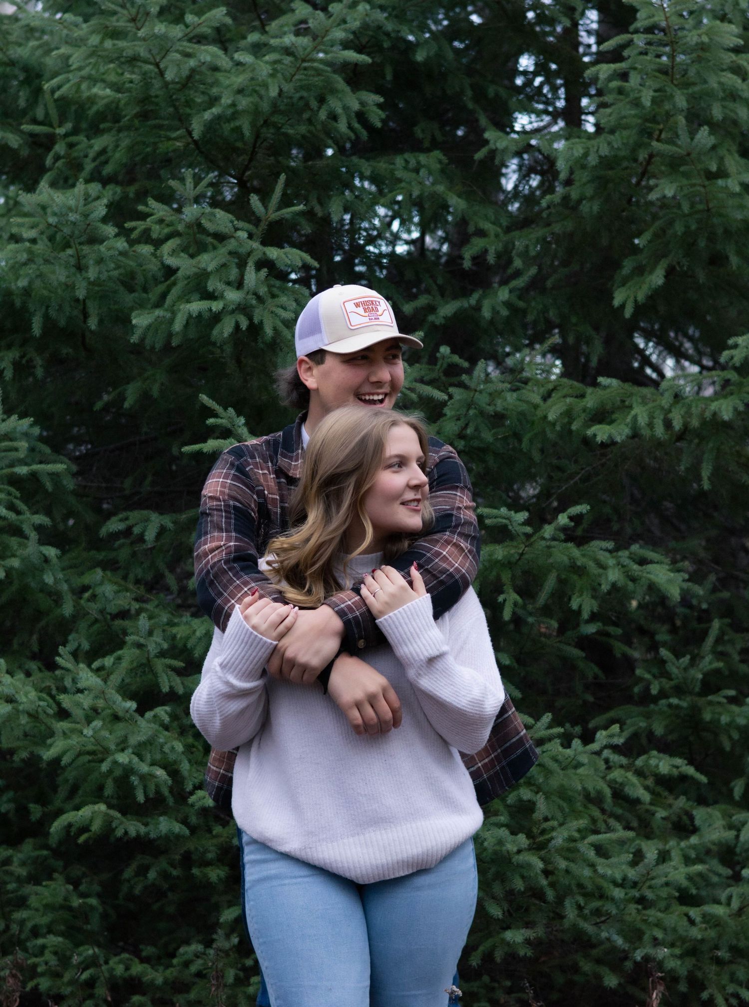couples picture in front of tree