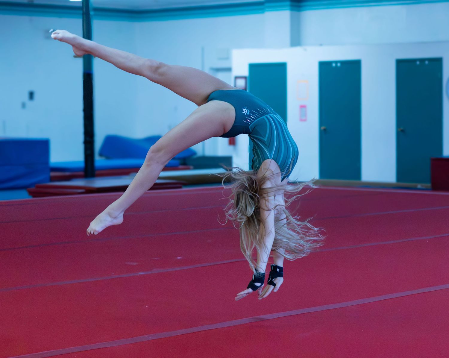 gymnastics backhand spring shot on floor