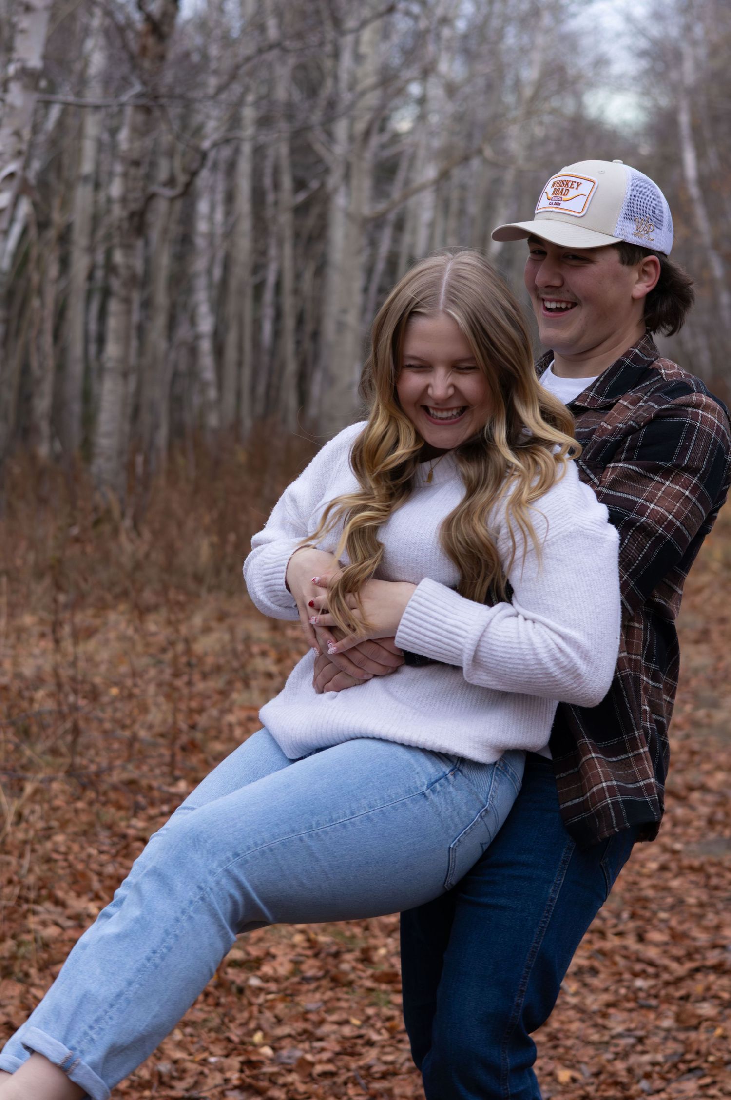 couples picture holding each other spinning
