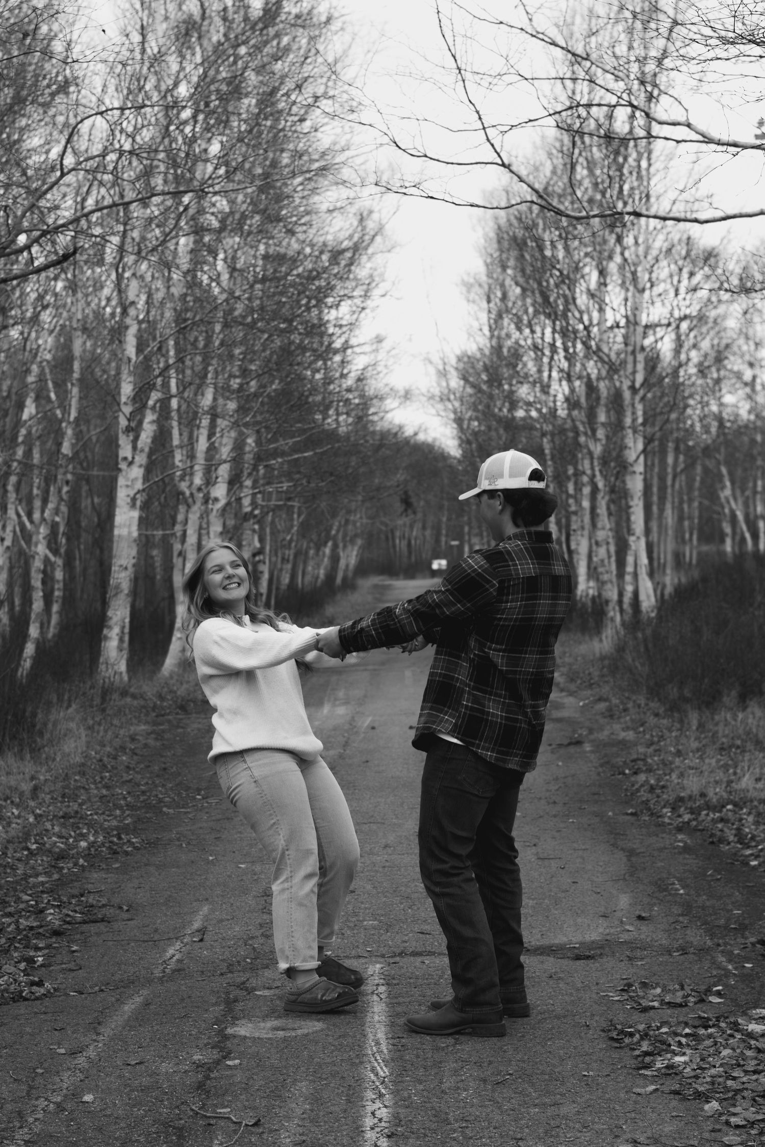 couples picture holding hands spinning