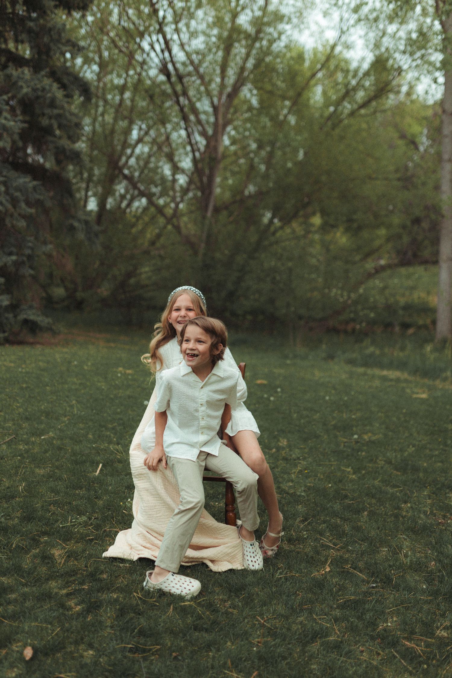 Candid portrait of kids playing and laughing together outdoors