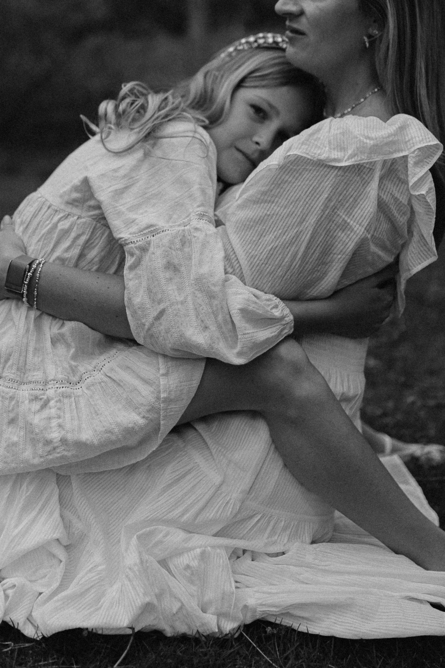 black and white photo of mother holding young daughter during outdoor northern colorado motherhood session