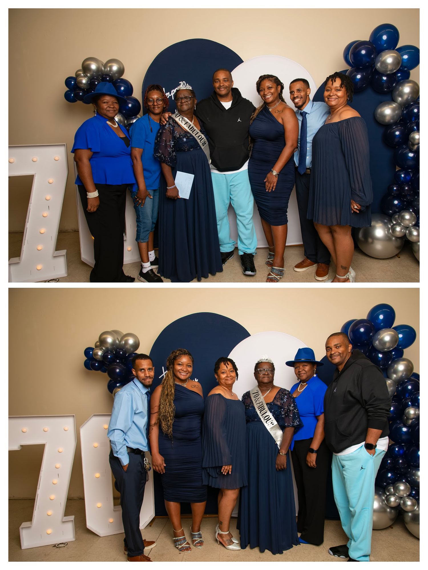 Group of elegantly dressed people posing at a navy blue and silver balloon decorated 70th birthday celebration event.