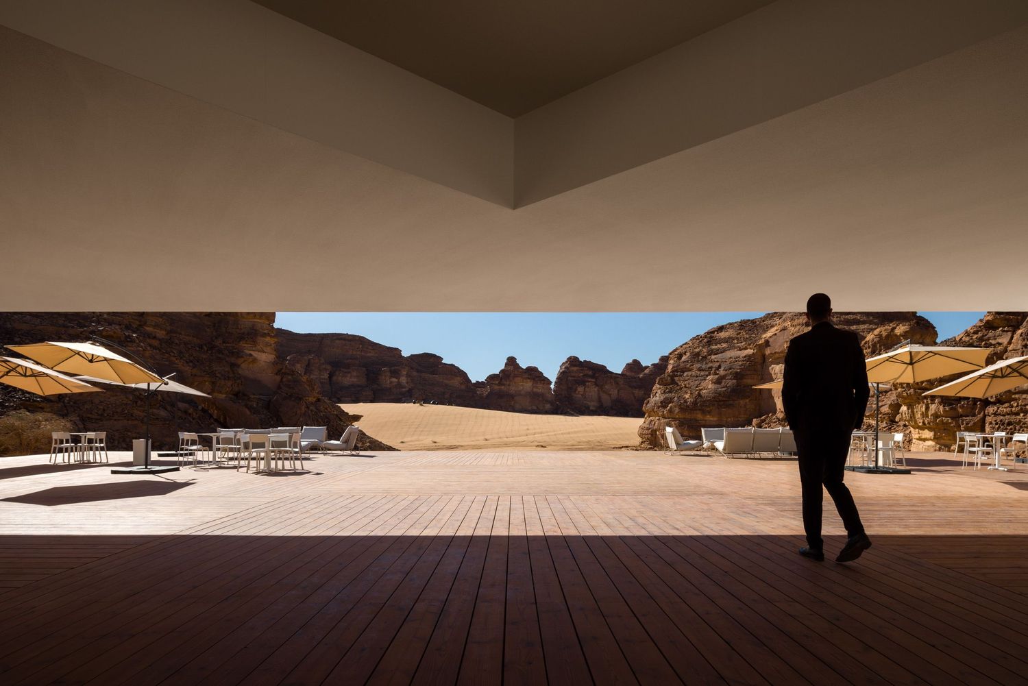 A panoramic view toward the landscape and artwork from the Desert X AlUla 2024 visitor center by KWY.studio
