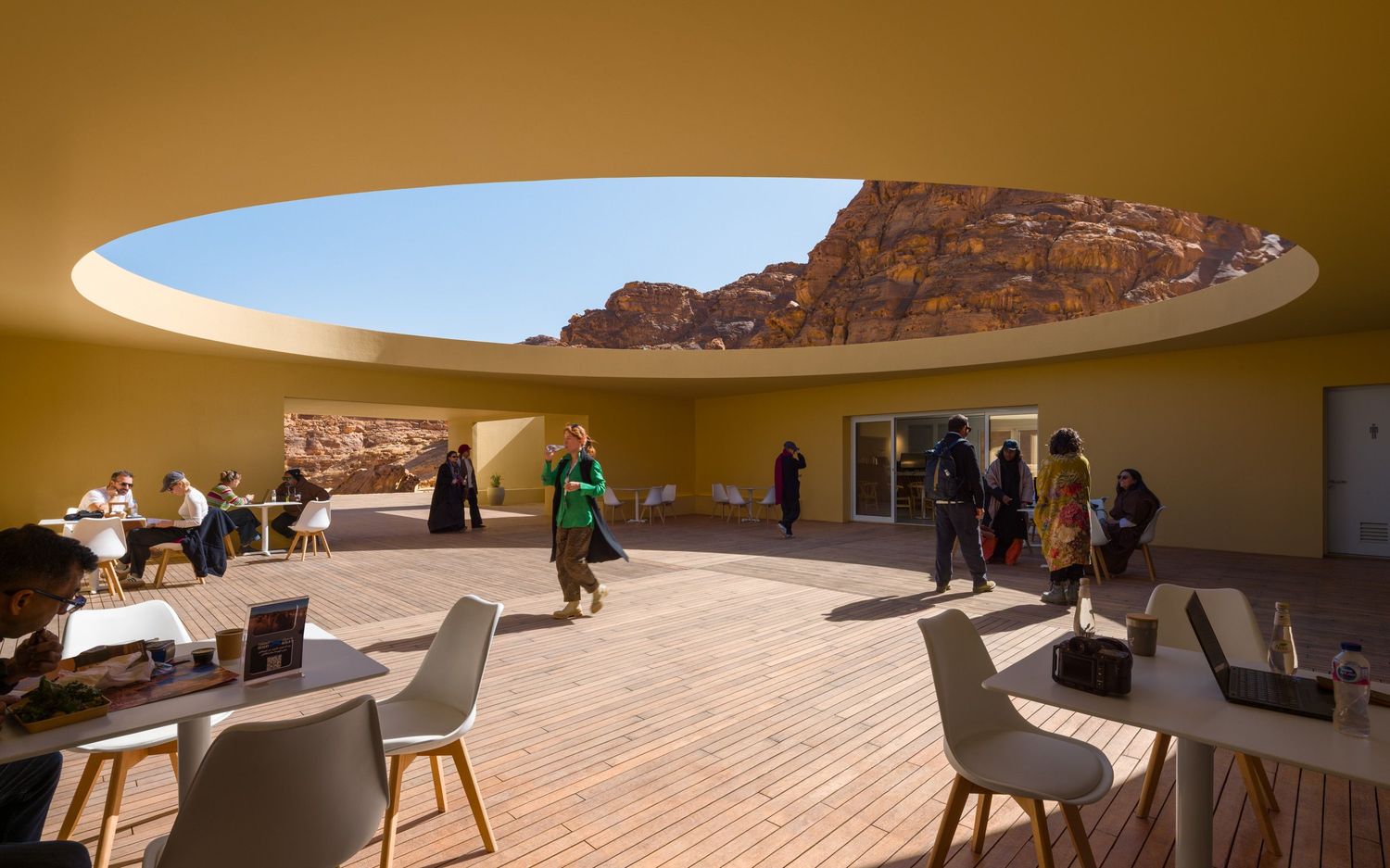 People dining in the open air at the 2026 Desert X Visitor Center in AlUla