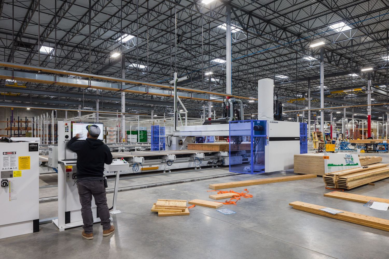 Operator using manufacturing eqipment at Plant Prefab built by ARCO/Murray design build