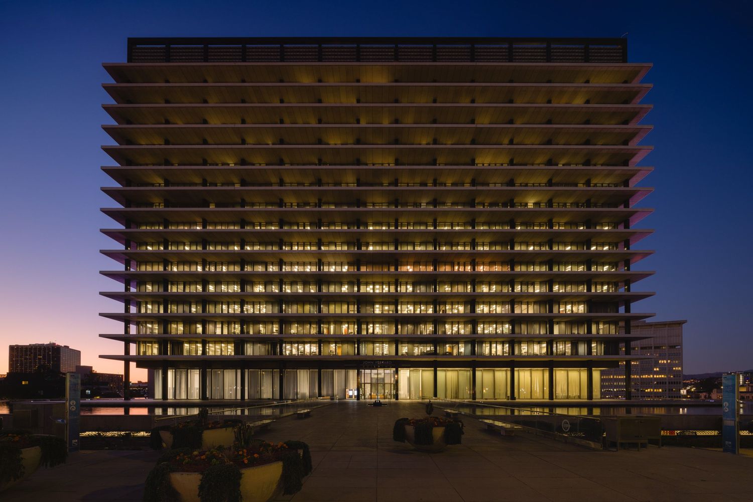 Full front axis nighttime view of Department of Water and Power/John Ferraro building in Los Angeles