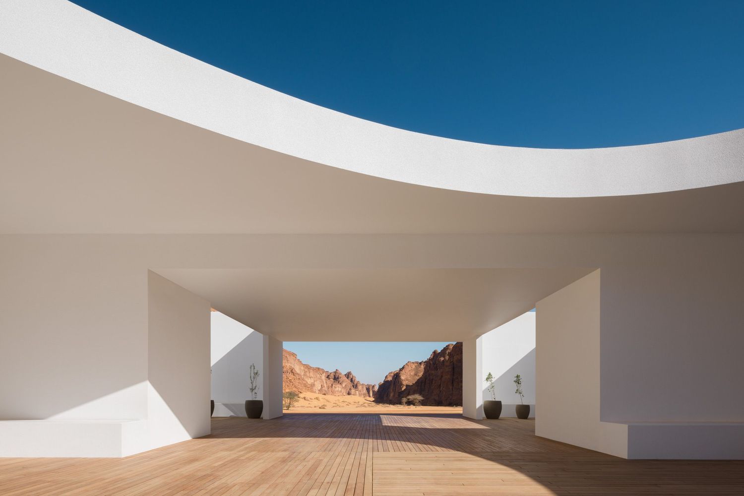 The Desert X 2022 Visitor Center in white. Located in AlUla Saudi Arabia, architecture by kwy.studio