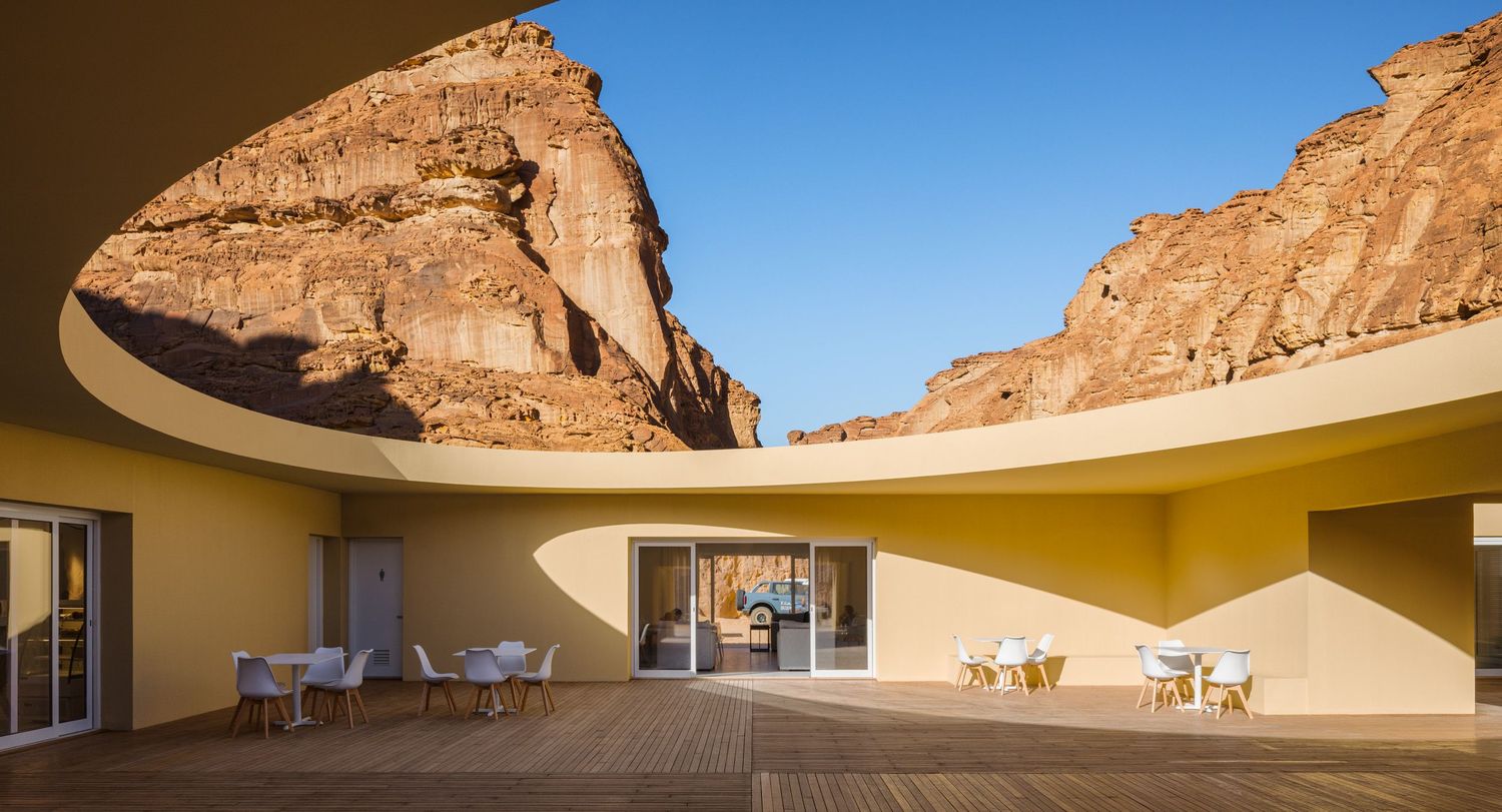 The Desert X 2026 Visitor Center in AlUla Saudi Arabia during morning light, architecture by kwy.studio