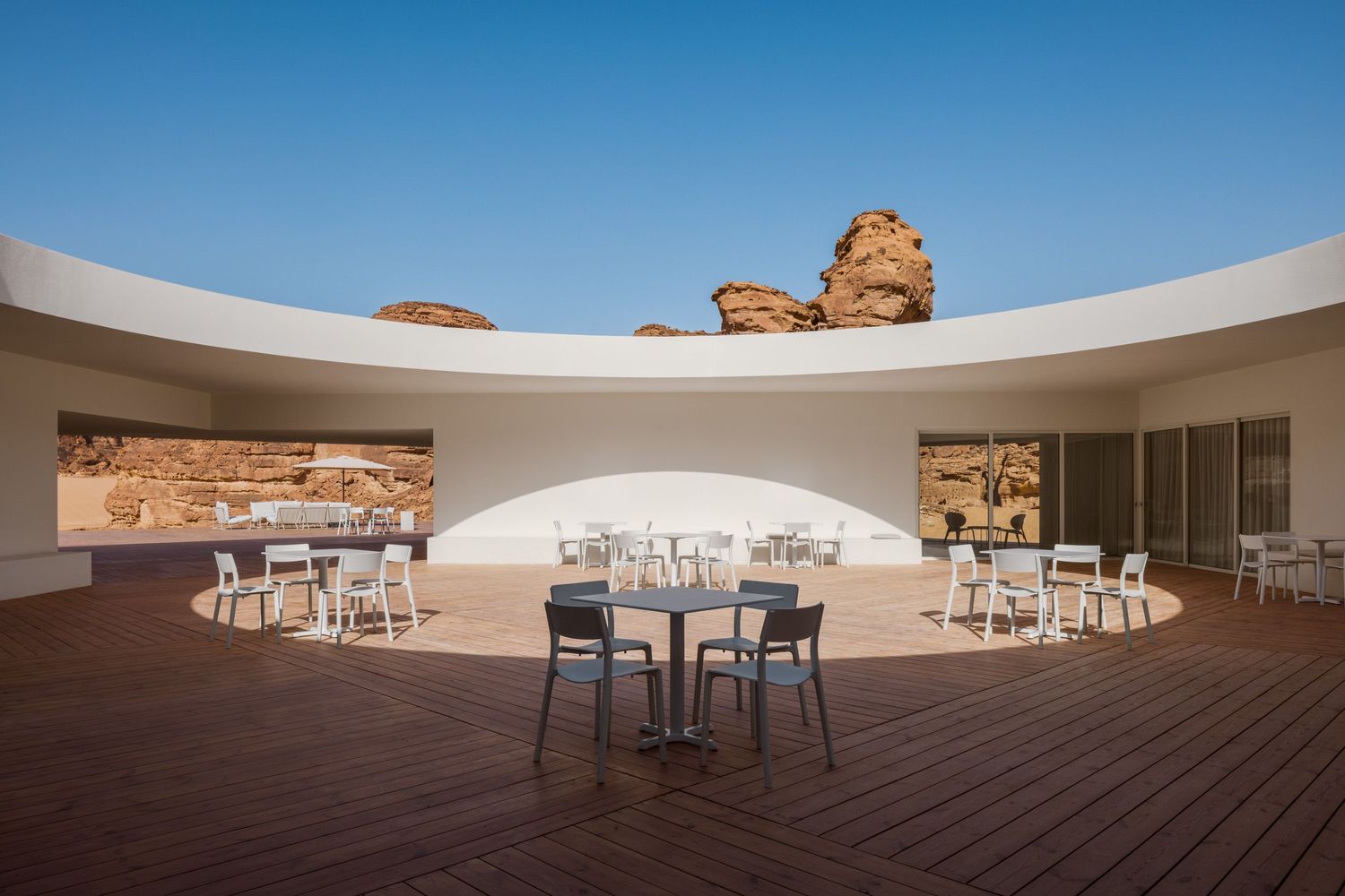 Sunlight and shadows in the courtyard of the Desert X AlUla 2024 visitor center by KWY.studio