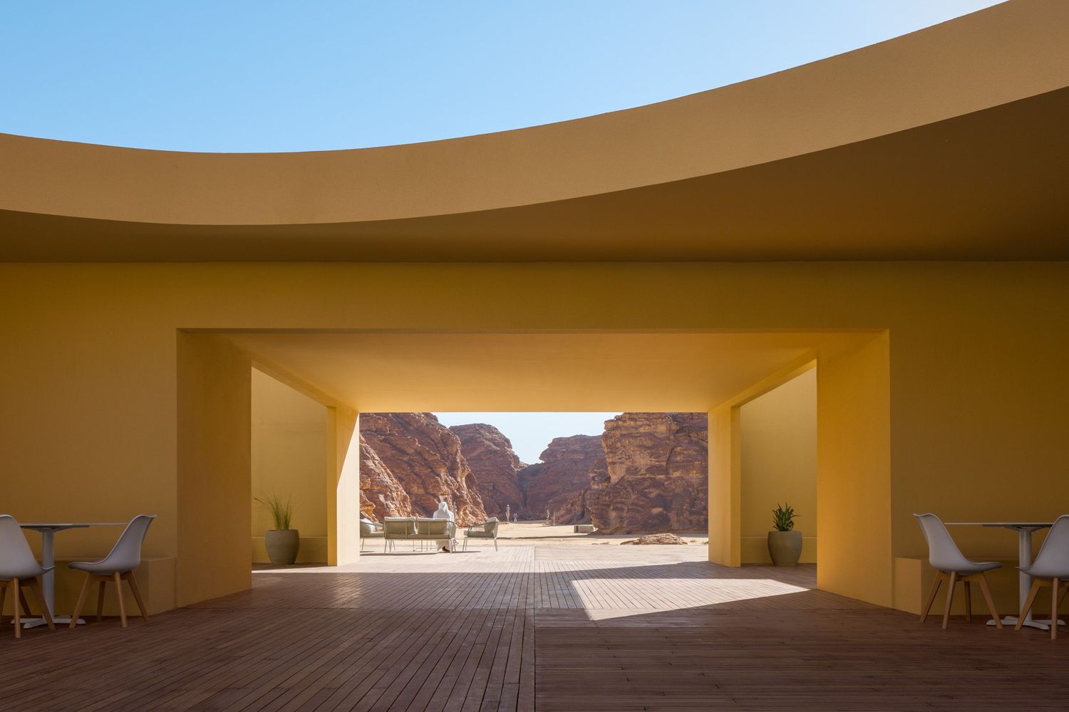 The Desert X 2026 Visitor Center in tan. Located in AlUla Saudi Arabia, architecture by kwy.studio