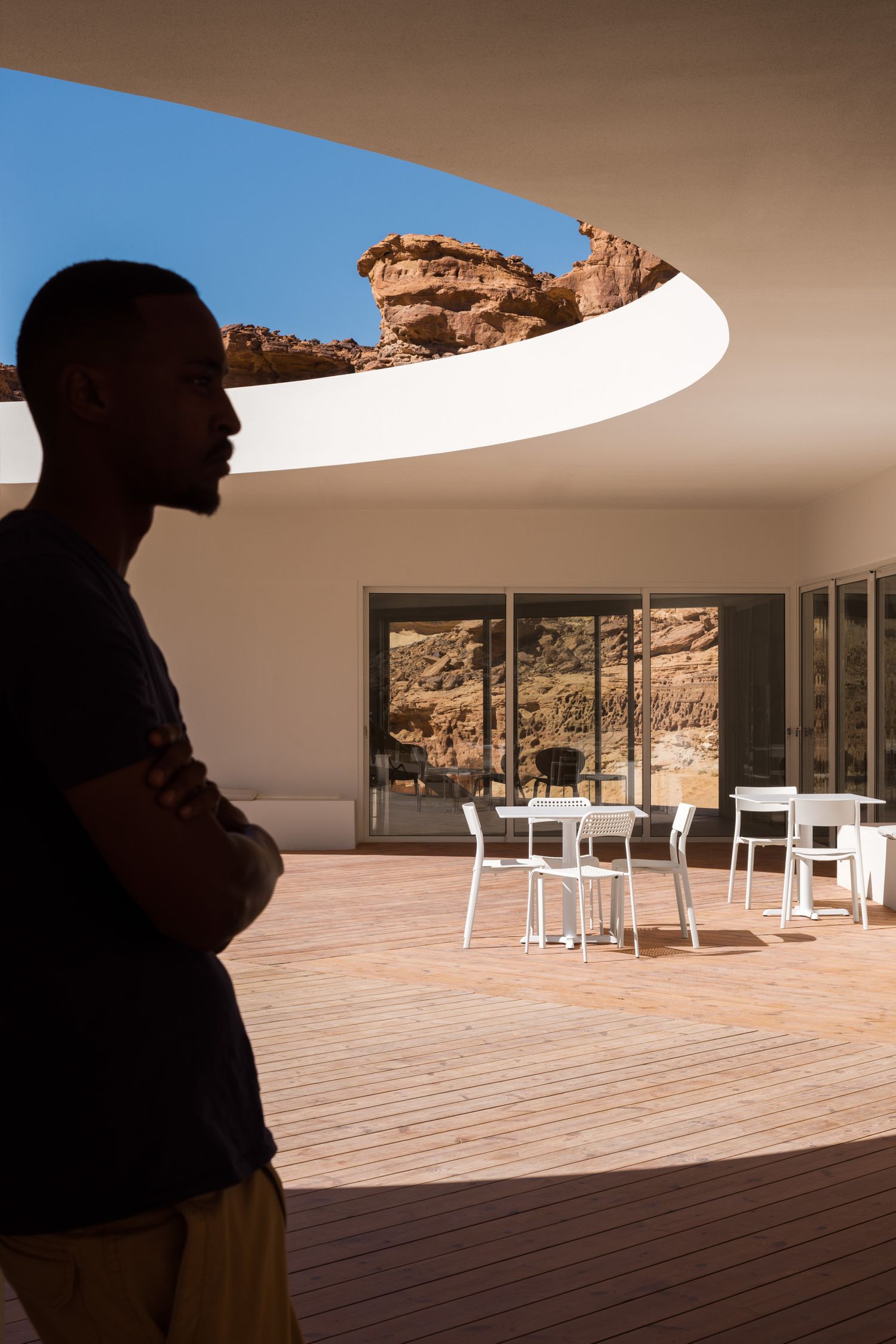Silhouette of a man leaning against a wall at the Desert X AlUla 2024 visitor center in AlUla Saudi Arabia
