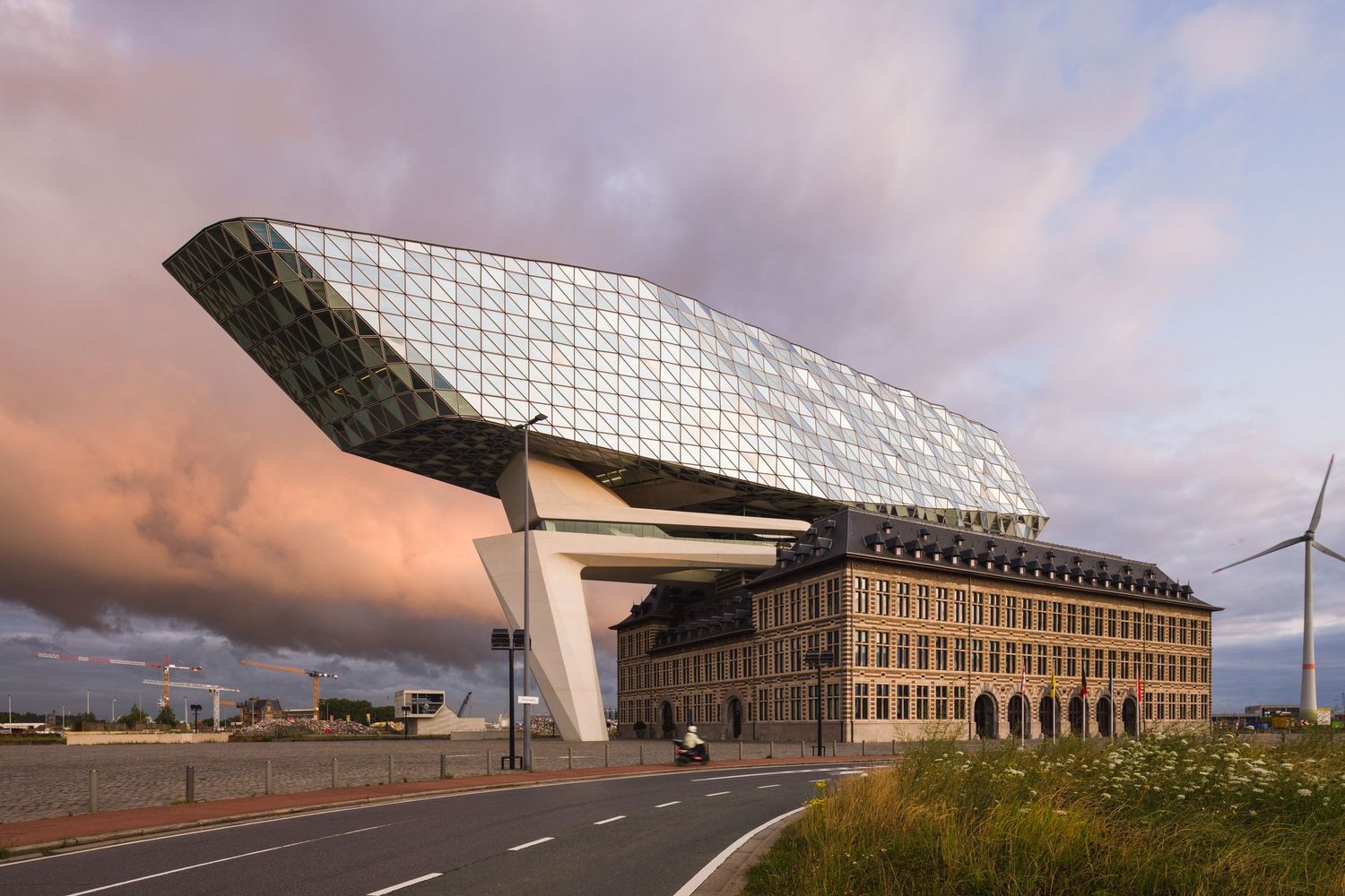 Antwerp Port Authority building by Zaha Hadid Architects during a colorful sunrise