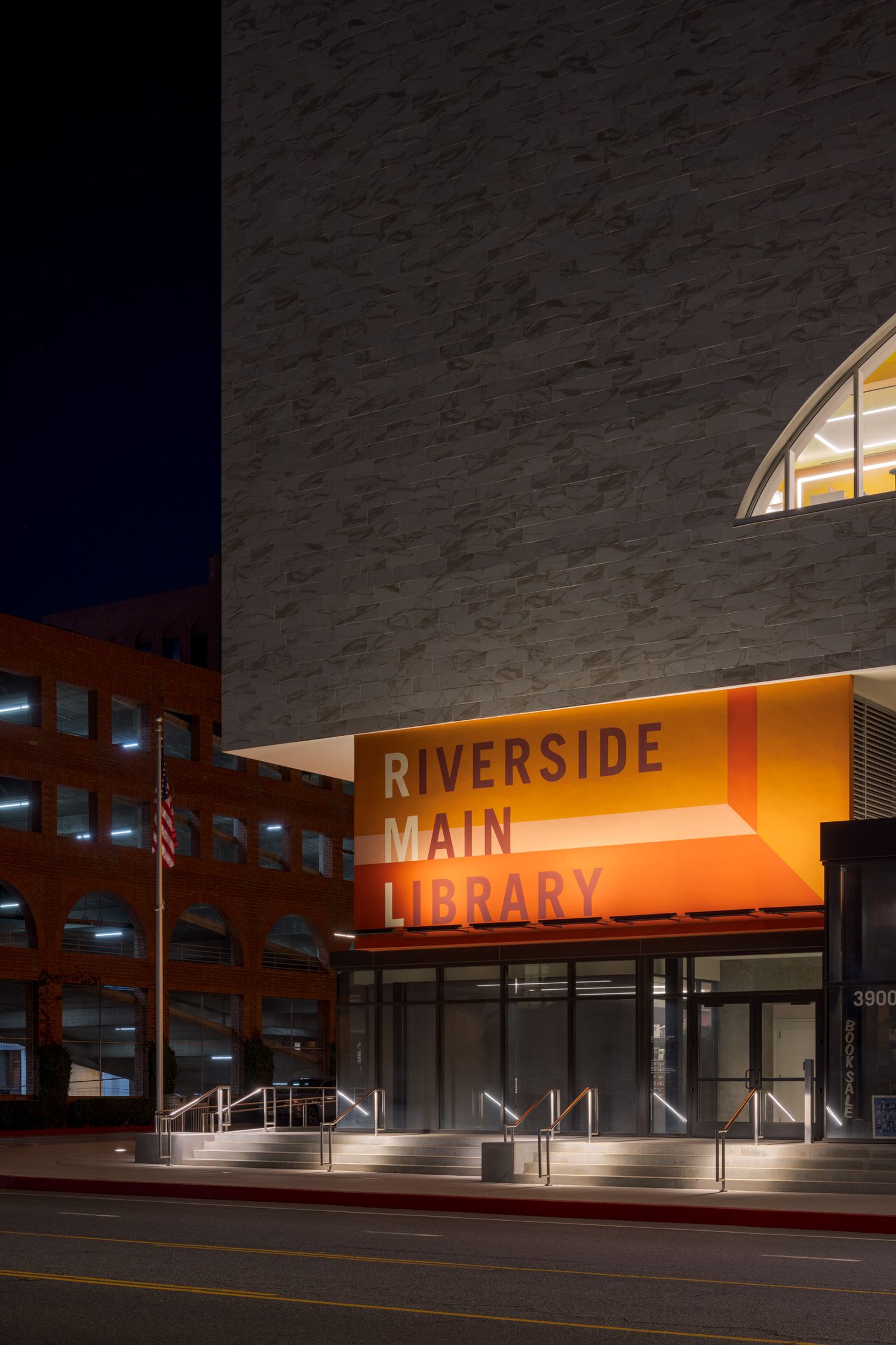 Corner of the Riverside Main Library at night with an Edward Hopper feel
