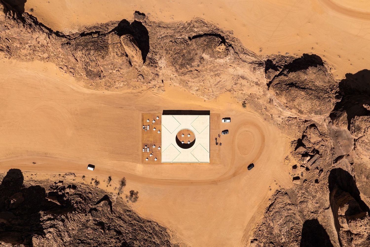 Top-down aerial view of the Desert X AlUla 2024 visitor center by KWY.studio surrounded by the rocky landscape