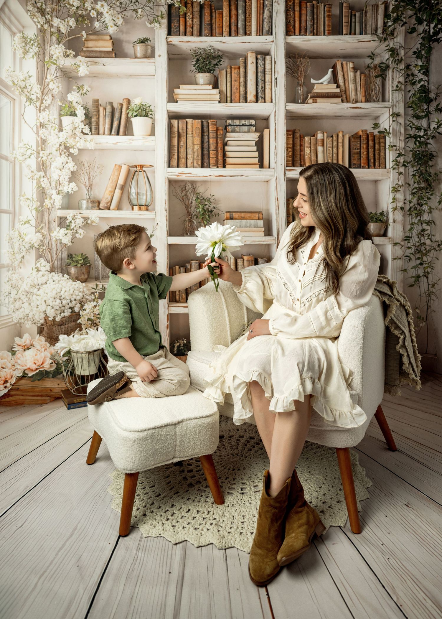 A cozy reading nook with white bookshelves, vintage furniture, and two people sharing a sweet moment against floral decor.