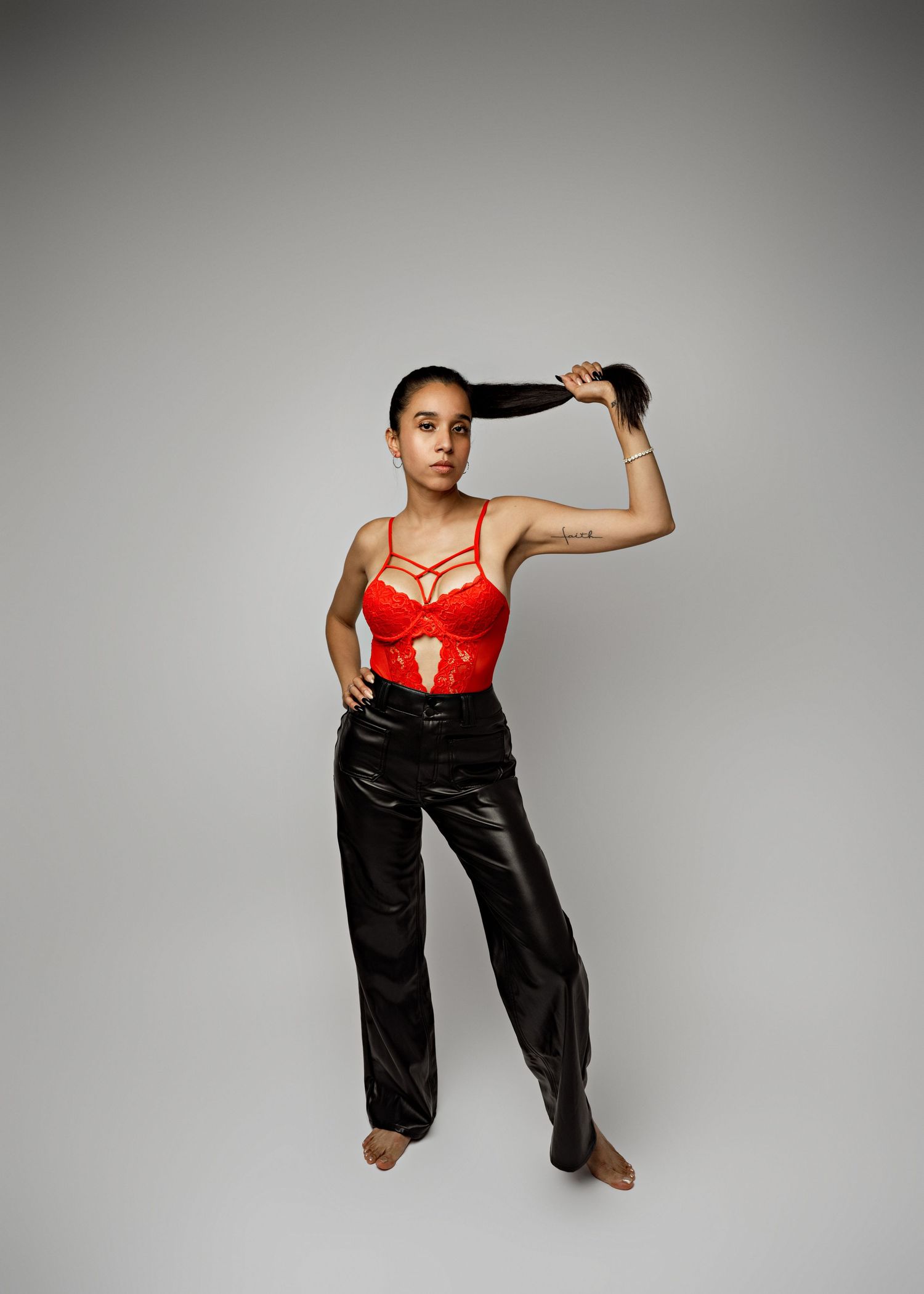 Person in red corset top and black pants strikes dynamic poses against white studio background showing body movement sequence.