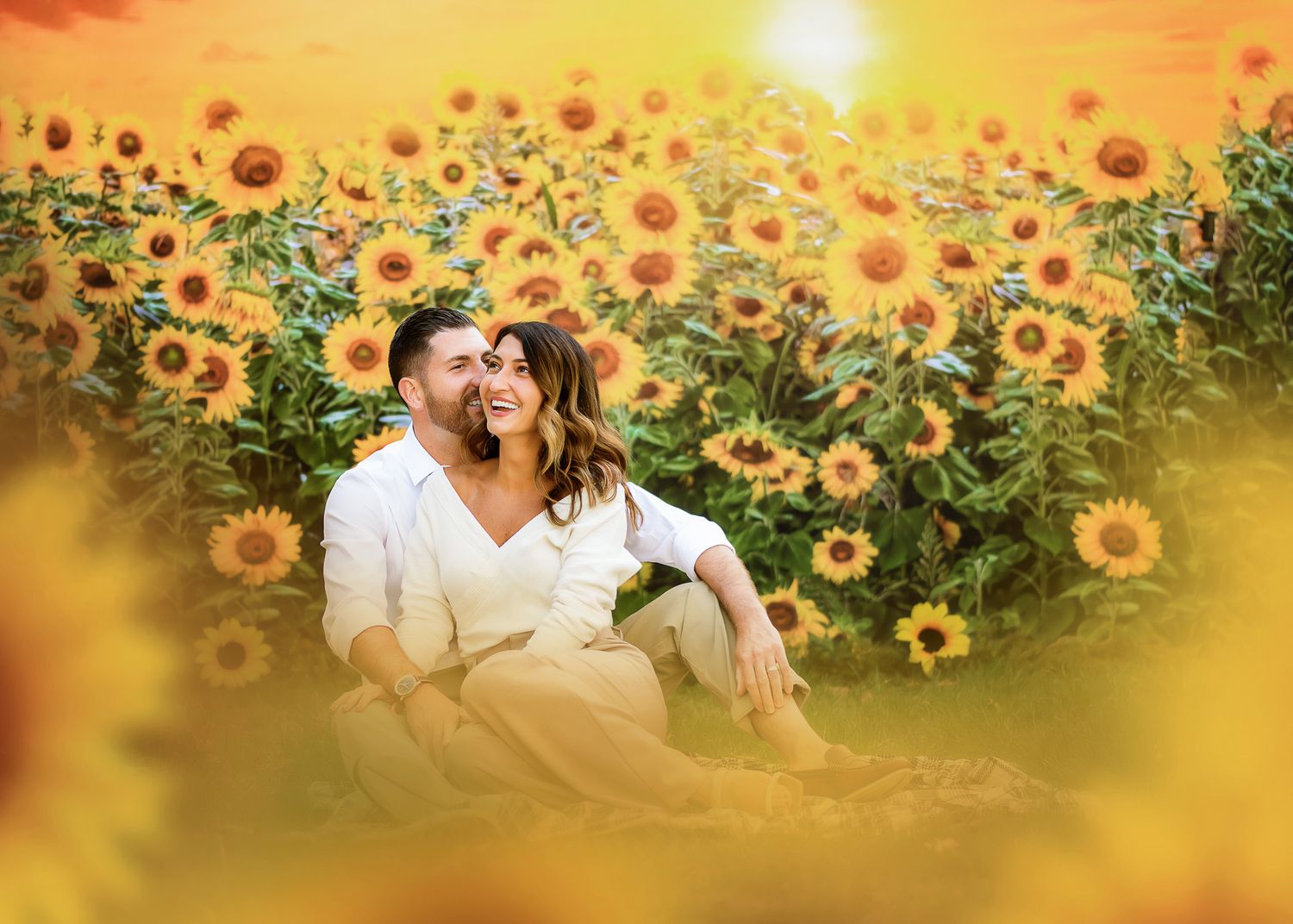 Romantic couple sharing tender moment in a vibrant sunflower field at golden sunset.