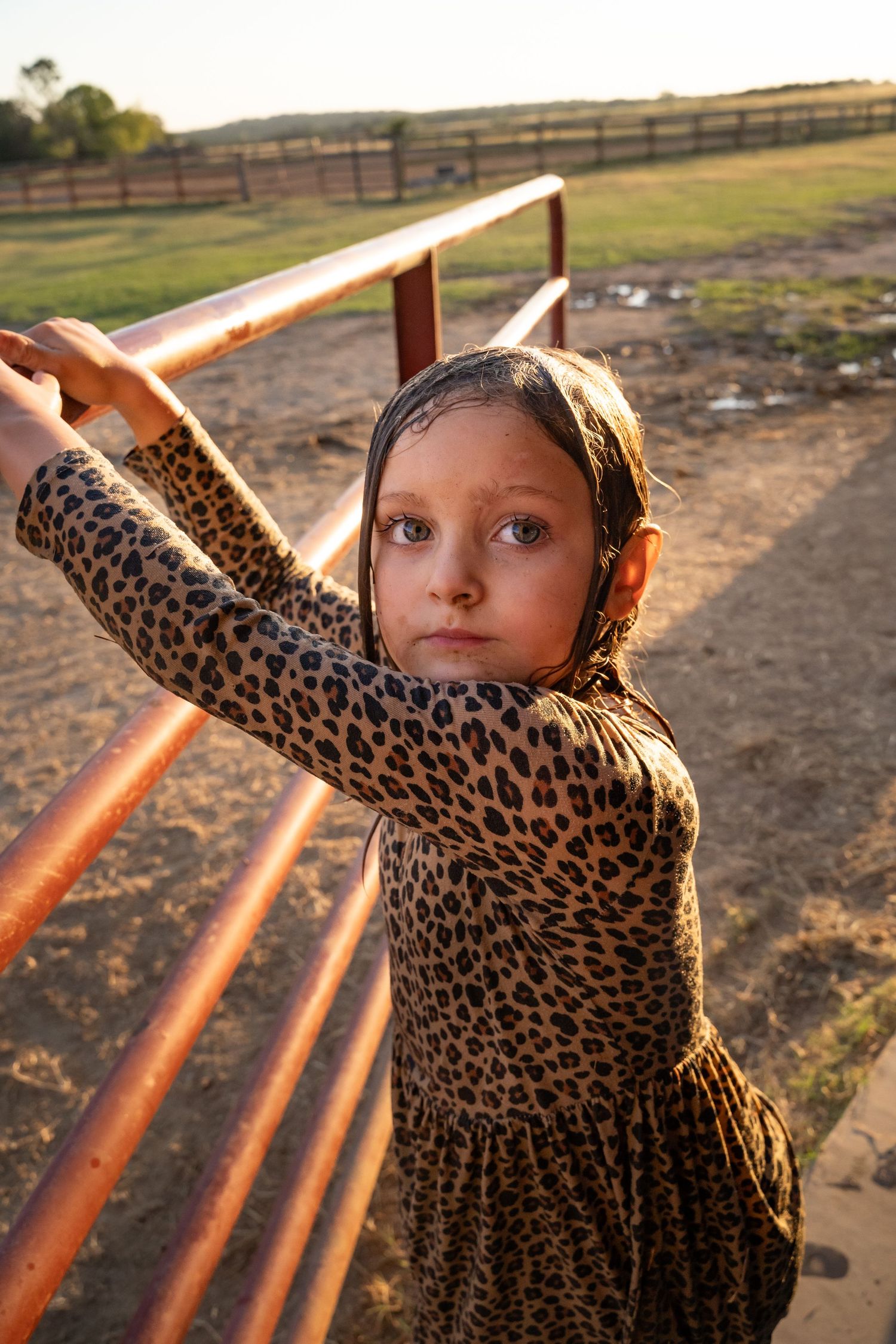 Child looks at camera during family photography session in Tulsa, Ok