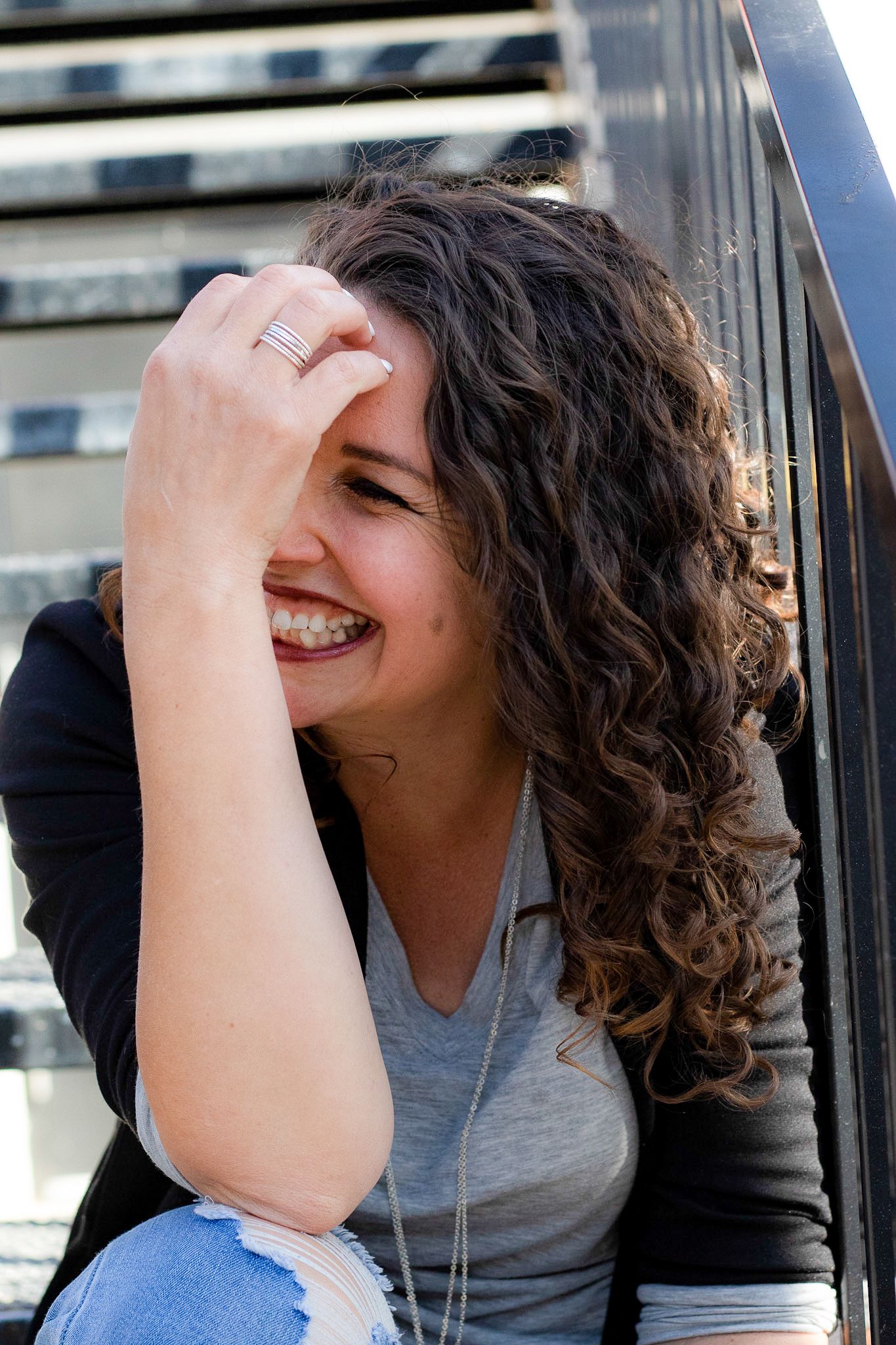 Spontaneous expressions of joy photographed against an industrial backdrop.