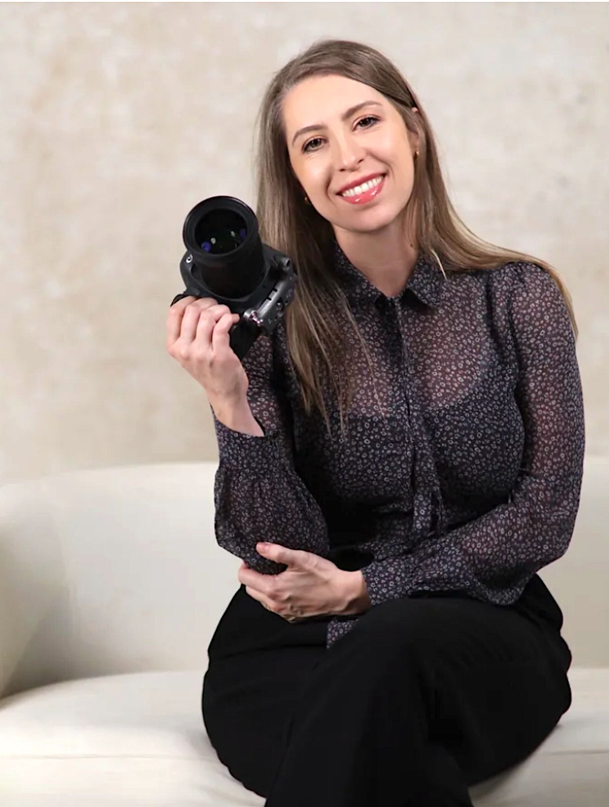 Person in polka dot blouse sitting with black cat on couch in sequence of playful poses.