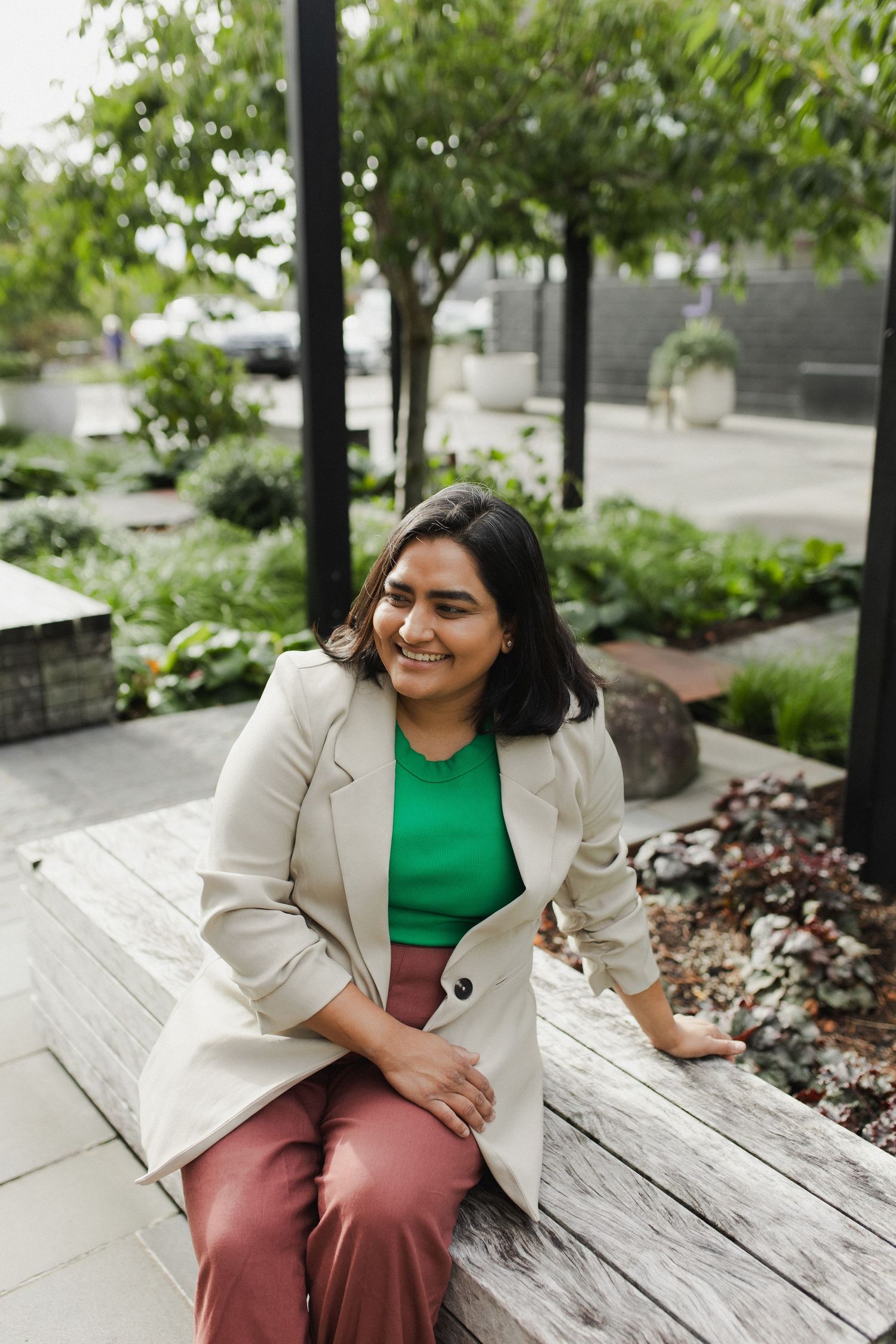 Woman sitting on bench during photoshoot in Hamilton