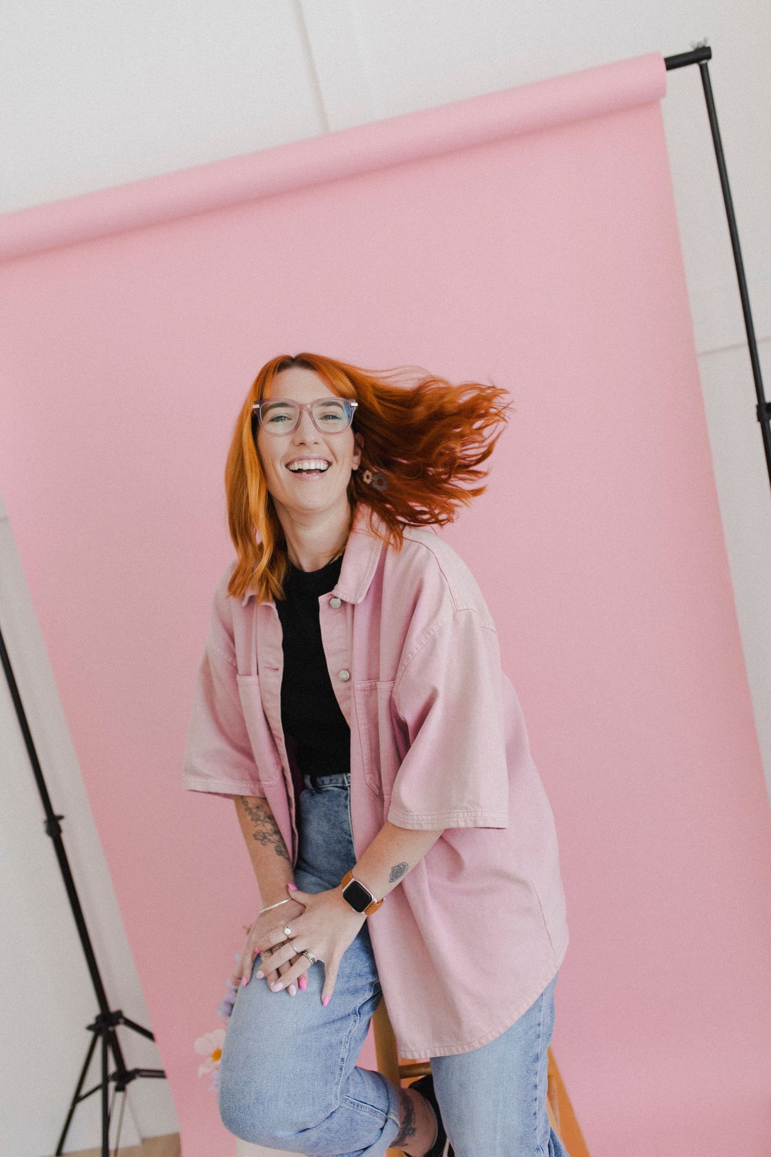 Woman laughing with hair flicking during branding shoot in Hamilton