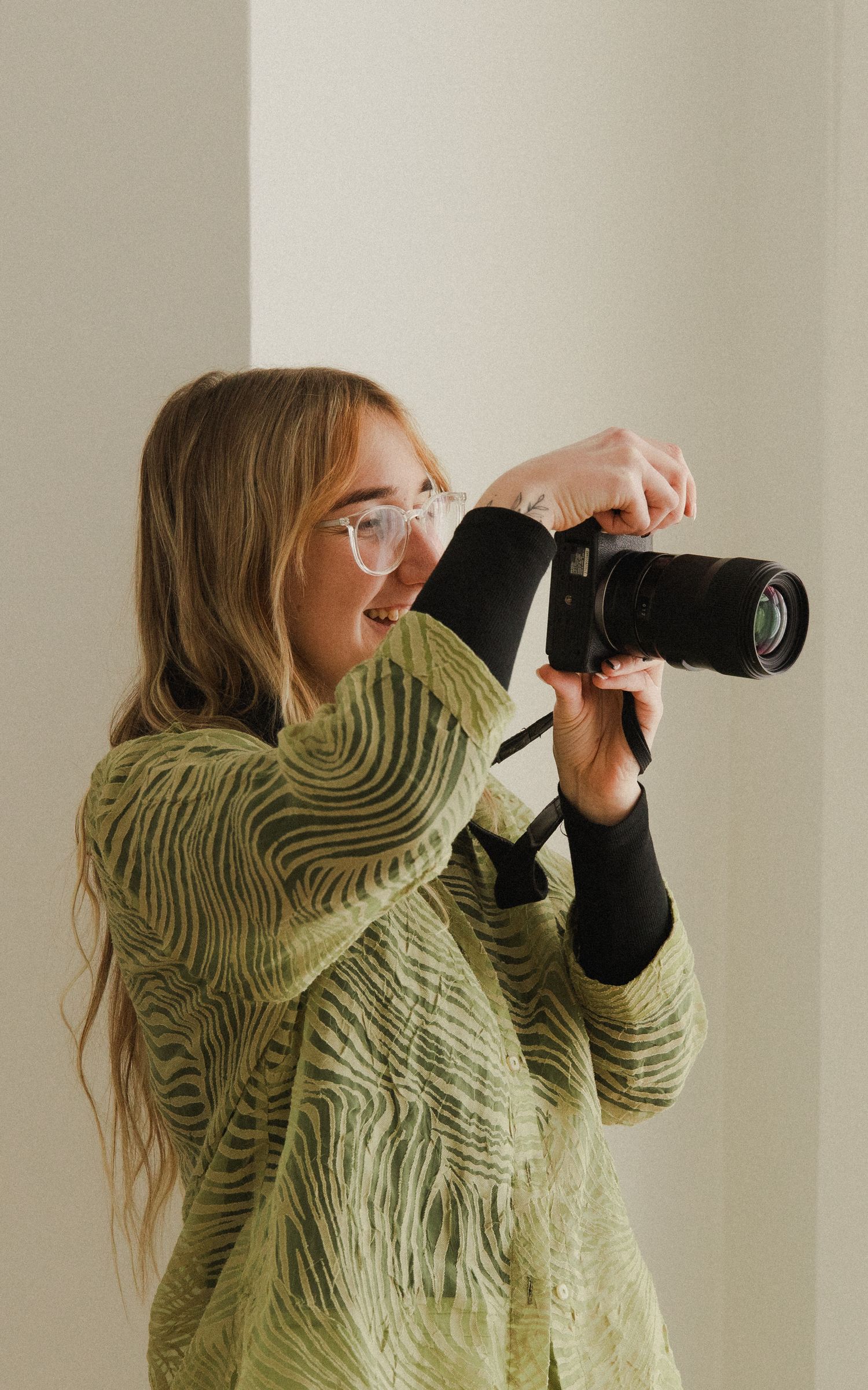 Woman taking a photo with a camera