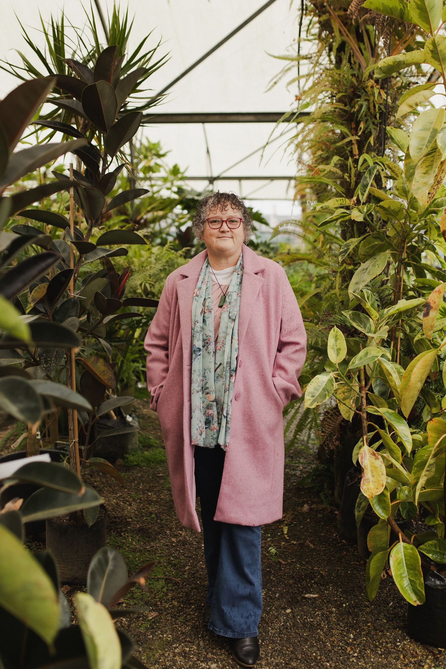Woman walking through plants in Hamilton