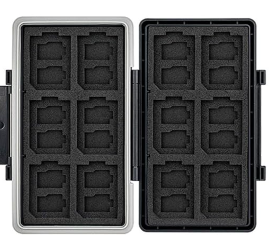 A black plastic storage case with multiple compartments designed to hold memory cards or gaming cartridges.