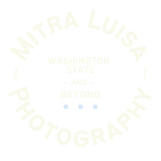 A circular white logo for Mitra Luisa Photography showing text for Washington State and Beyond services.