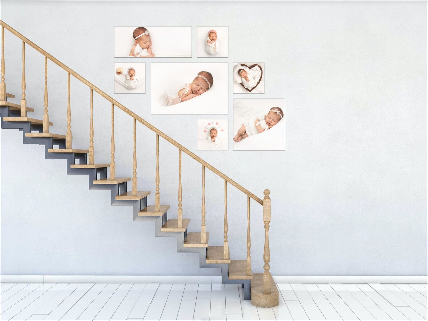 A minimalist wood staircase with floating steps features a collection of baby photos arranged along the white wall.