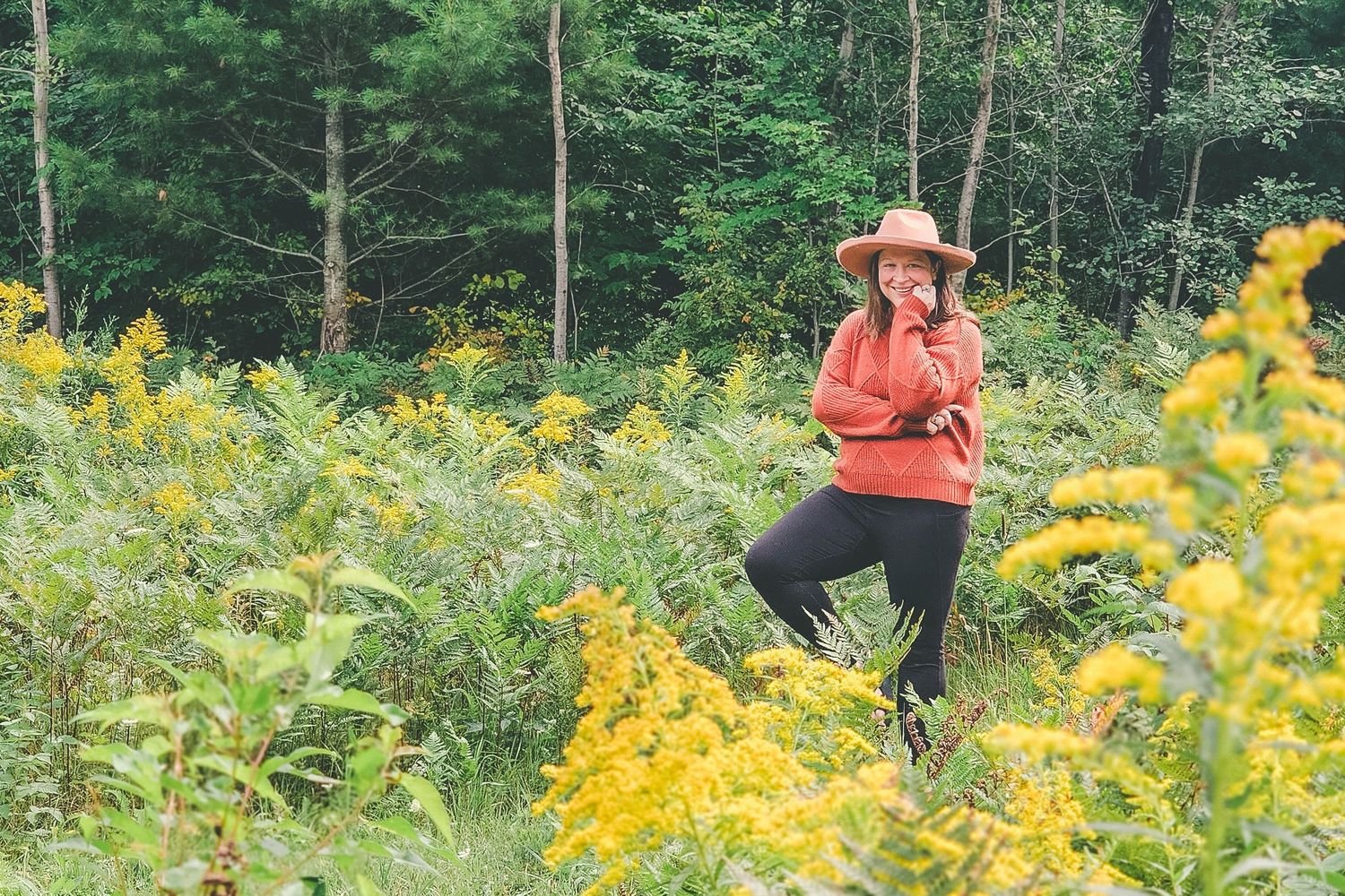 Self portrait personal branding session enjoying a lifestyle photography shoot in a field of flowers.