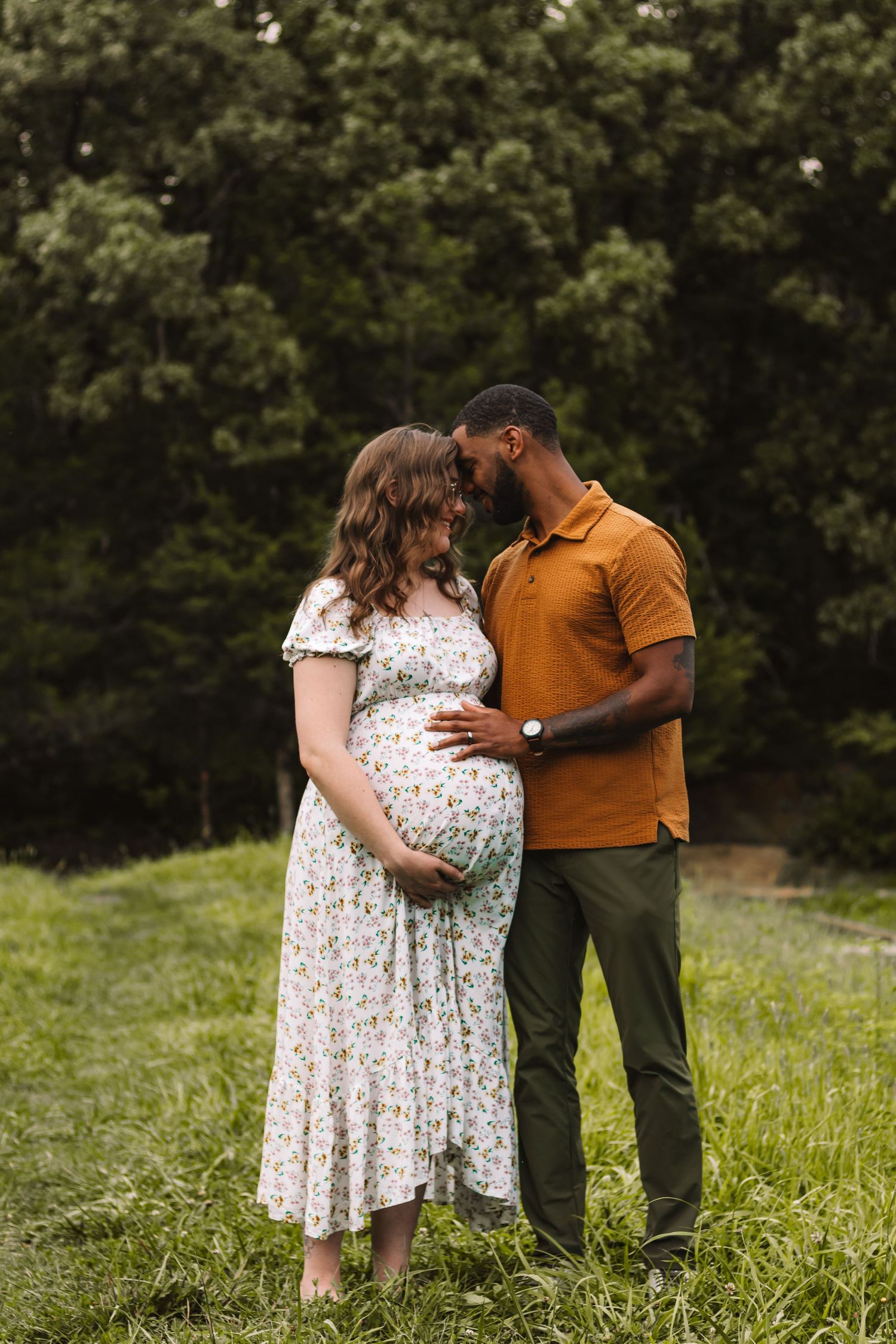Couple maternity photography session in natural field setting in lewis county Washington