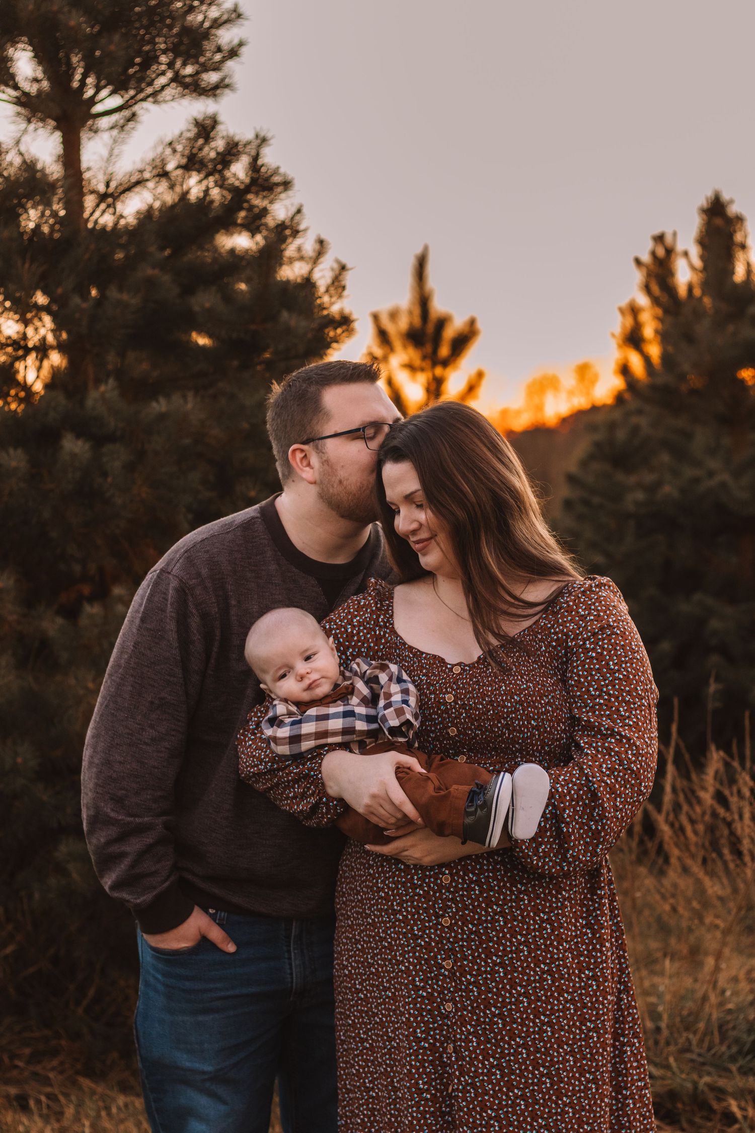 Family with their newborn child outdoor session