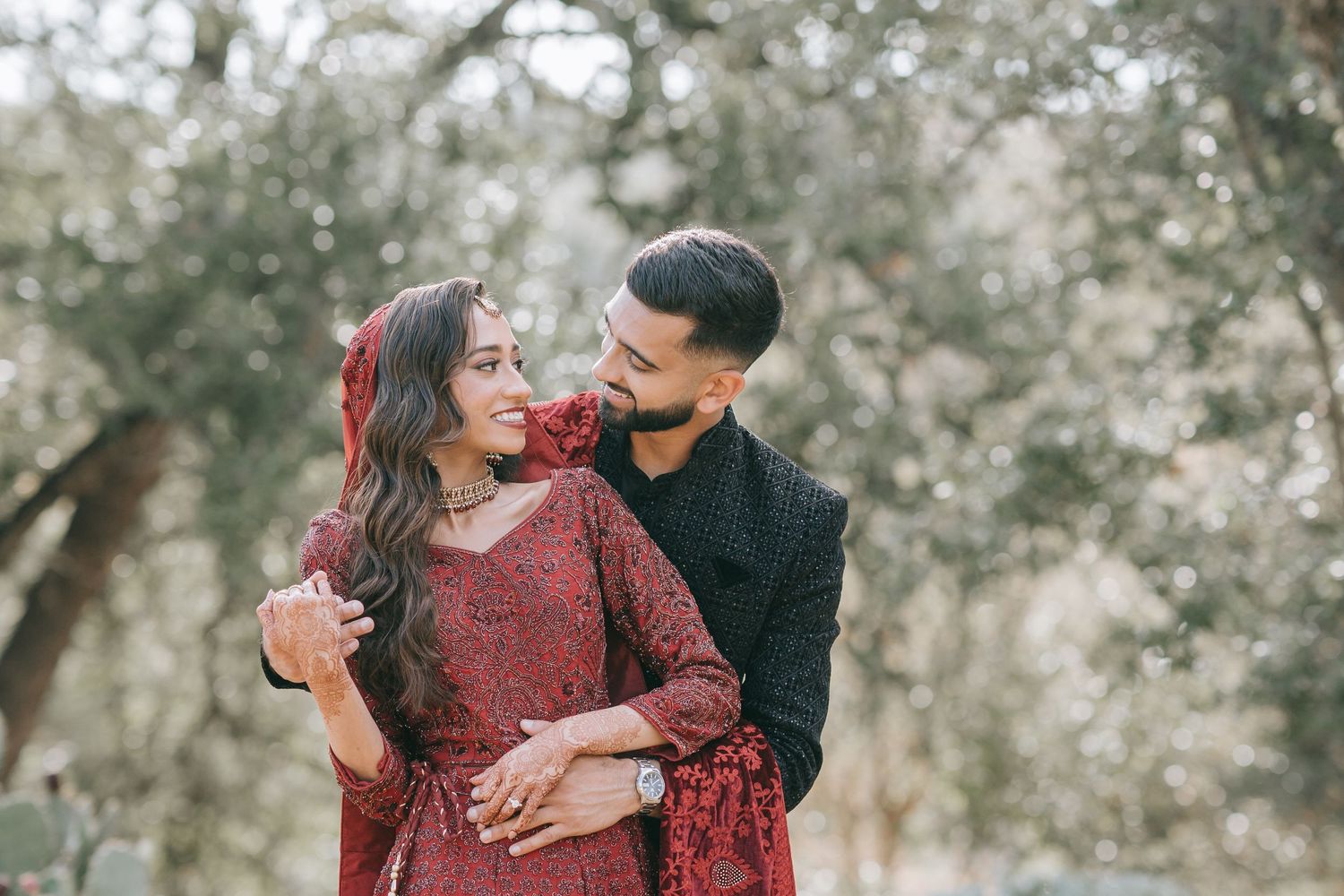 Couple in traditional attire during outdoor Indian wedding ceremony in Dallas.