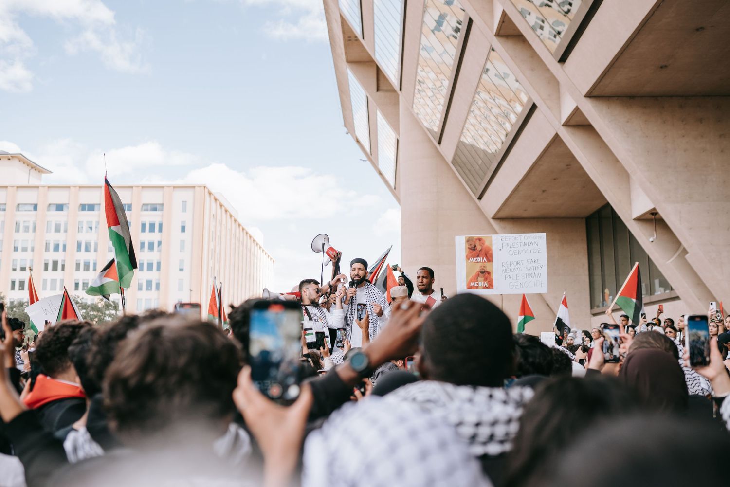 Imam Omar Suleiman giving a speech in downtown Dallas in-front of thousands of people.