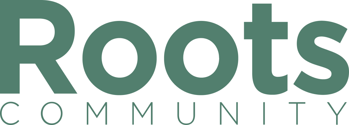 Simple green text logo reading 'Roots Community' in a modern font style.