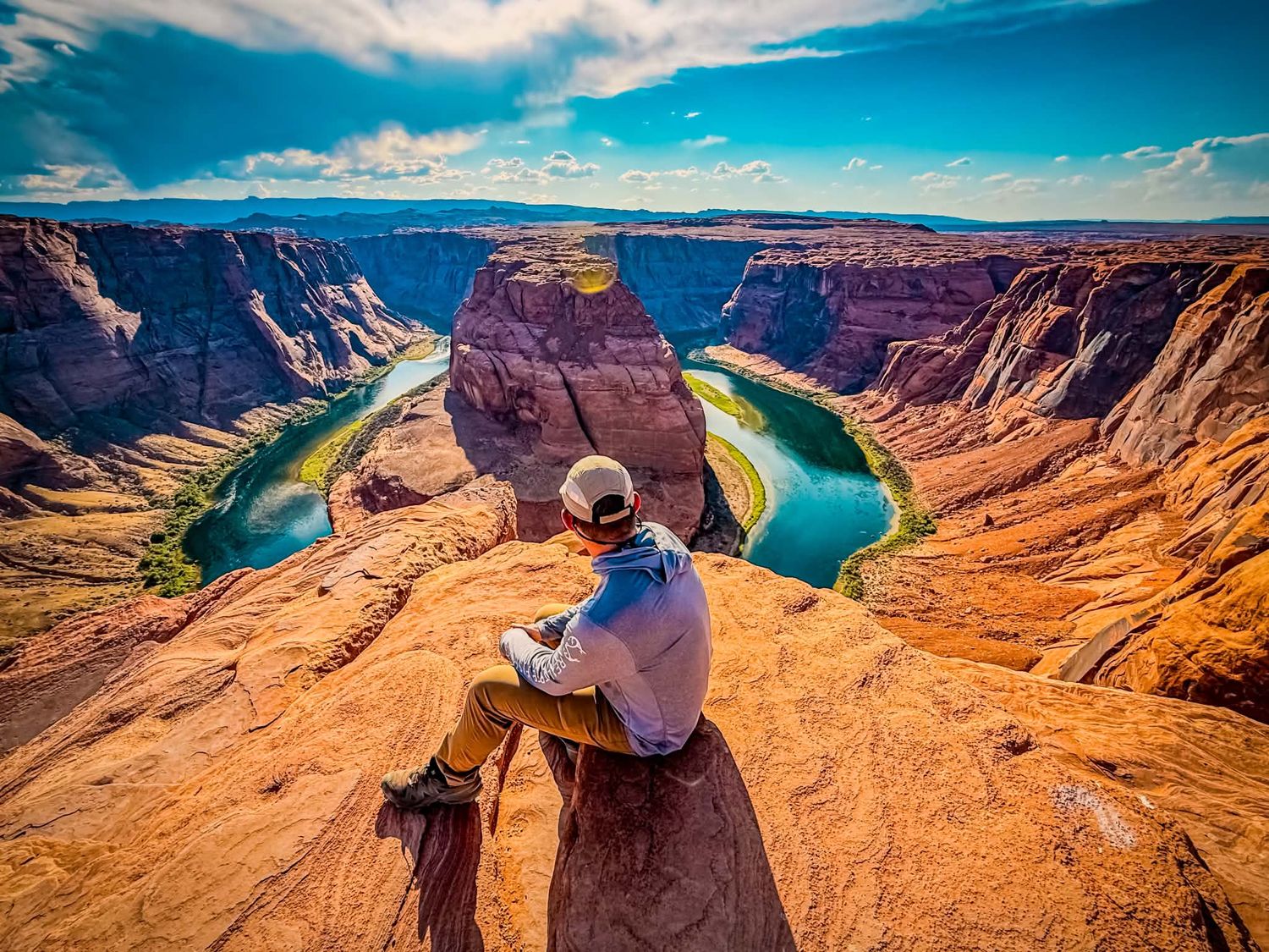Relaxing adventure portrait at Horseshoe Bend with sweeping desert and canyon views.