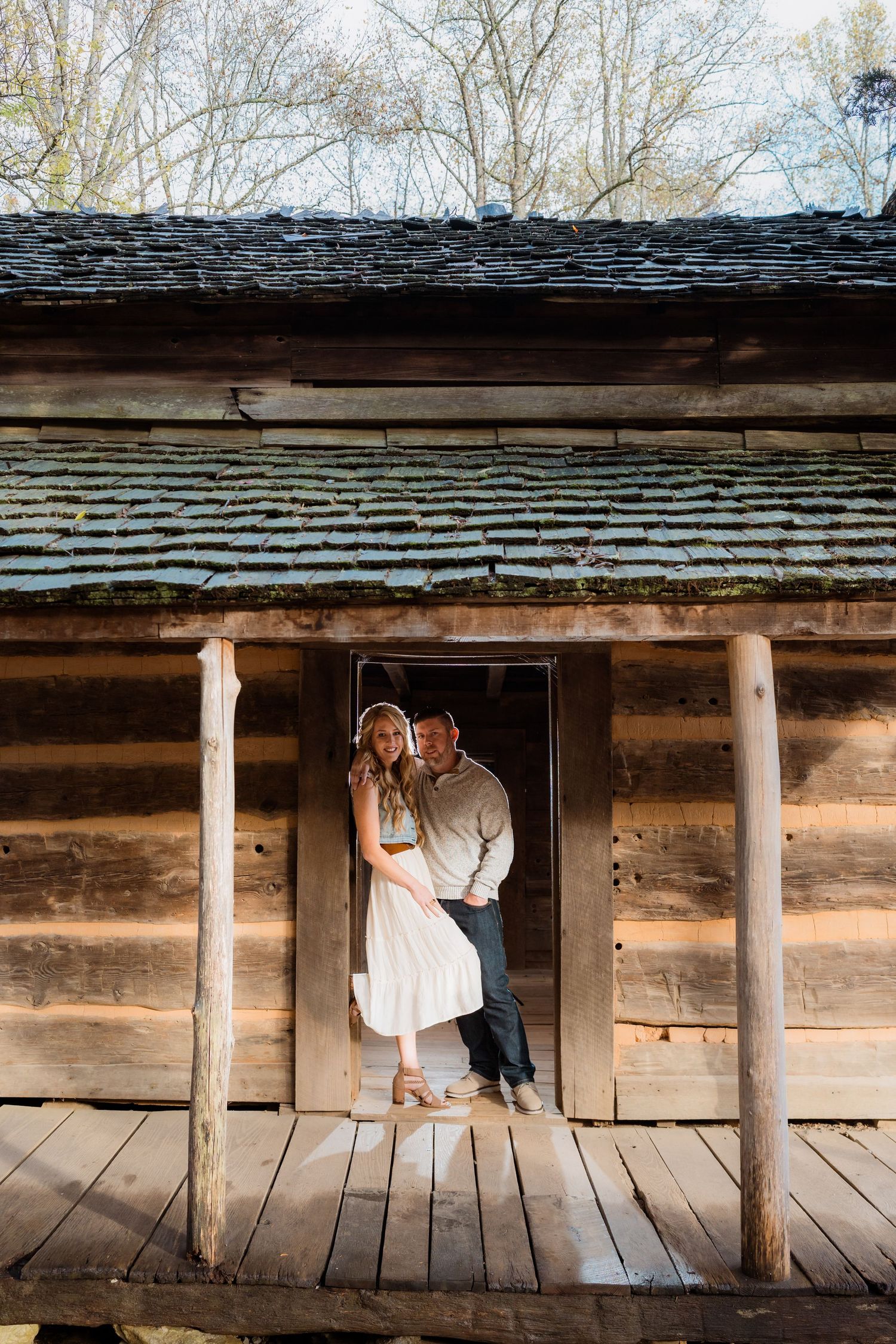 Engagement portraits in Cades Cove with scenic Smoky Mountain views.