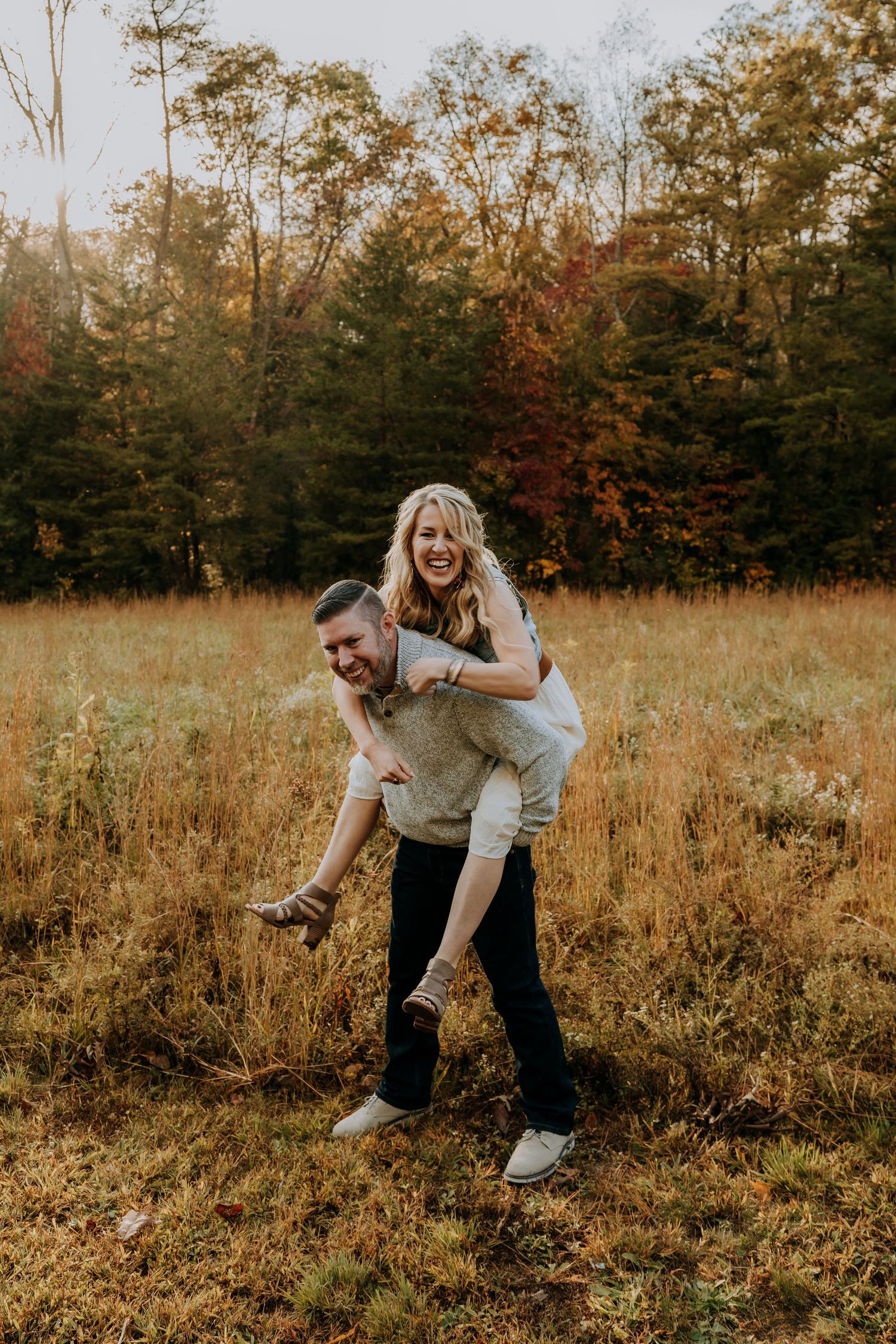 Engagement portraits in Cades Cove with scenic Smoky Mountain views.