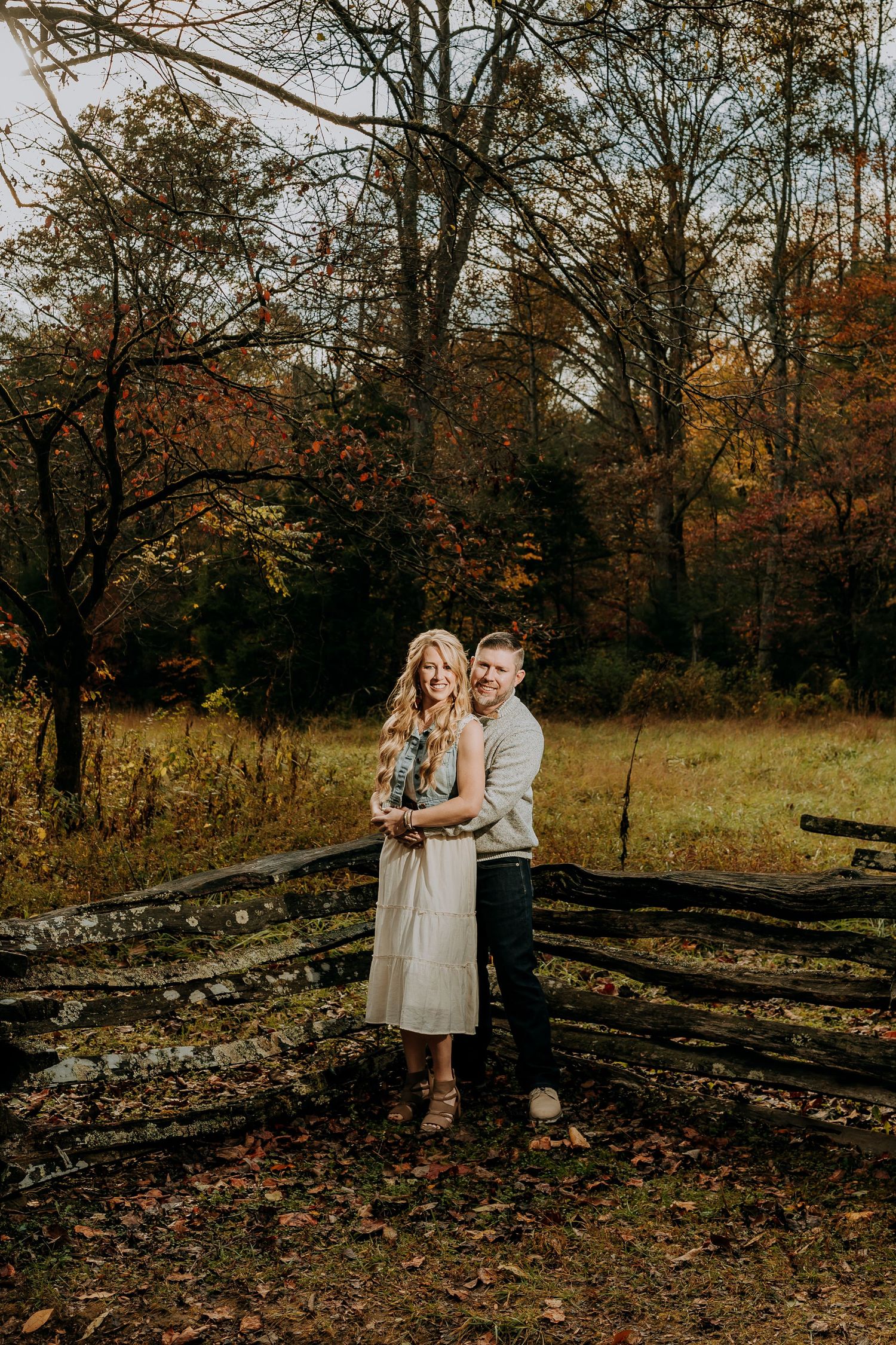 Engagement portraits in Cades Cove with scenic Smoky Mountain views.