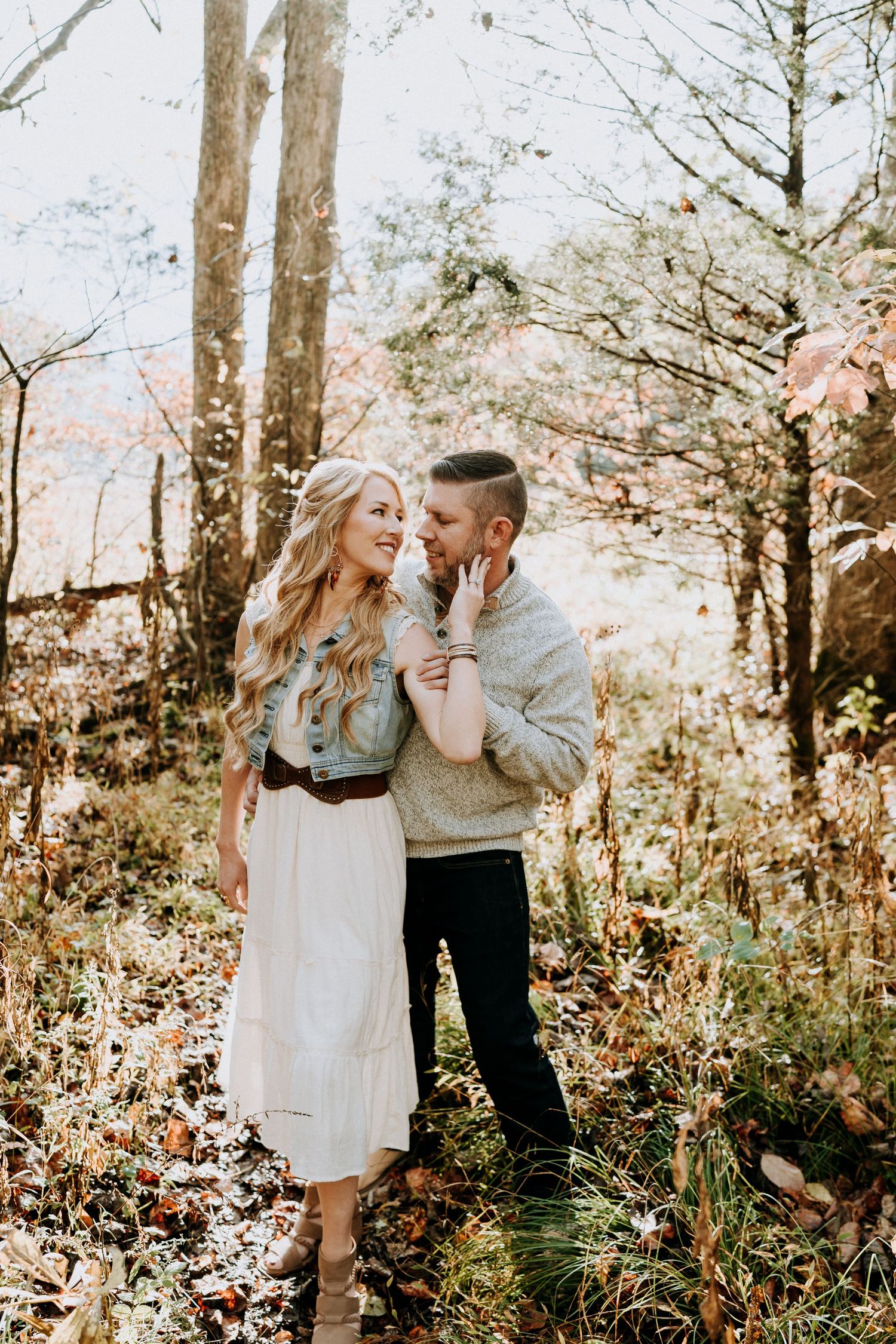 Engagement portraits in Cades Cove with scenic Smoky Mountain views.