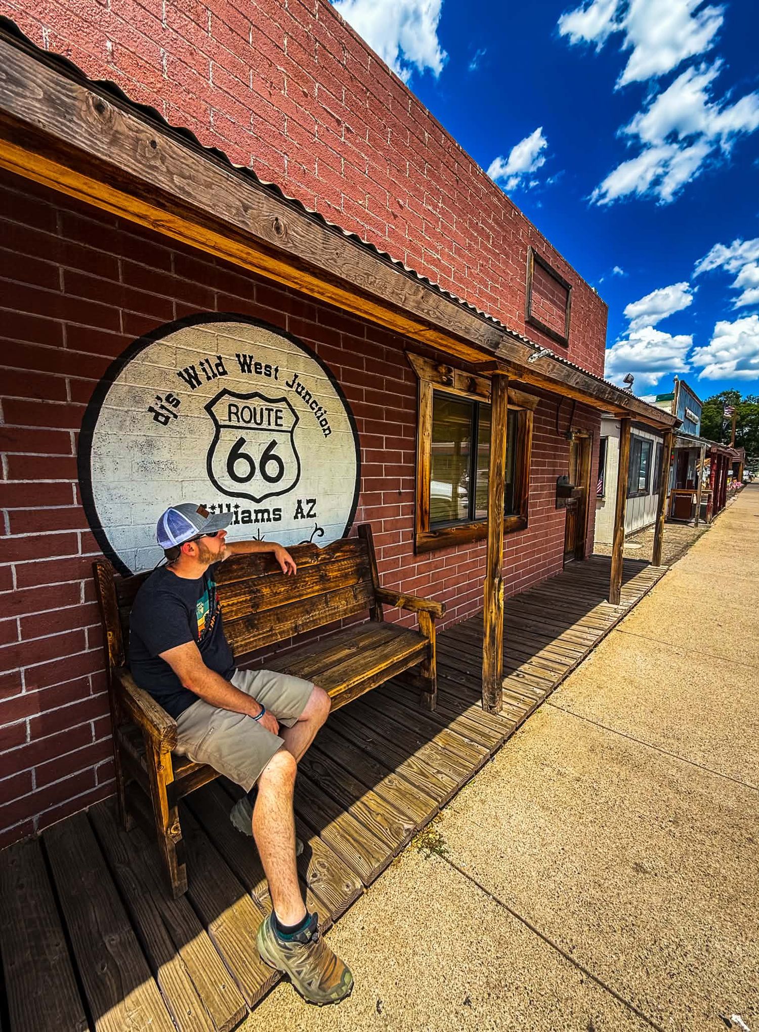 Couples portrait beneath the iconic Route 66 sign in Williams, Arizona.