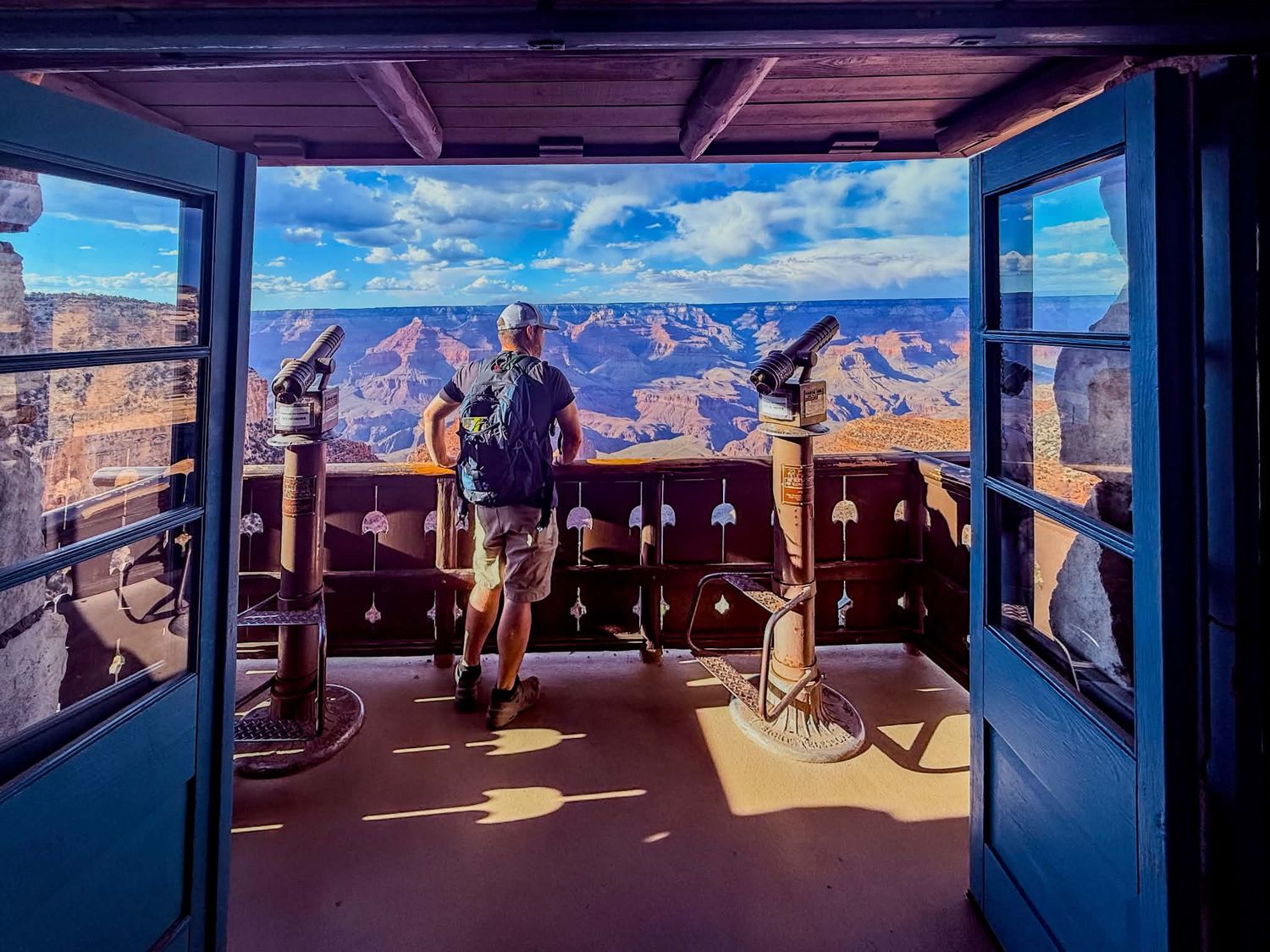 Adventure portrait from a Grand Canyon viewing platform with sweeping canyon views.