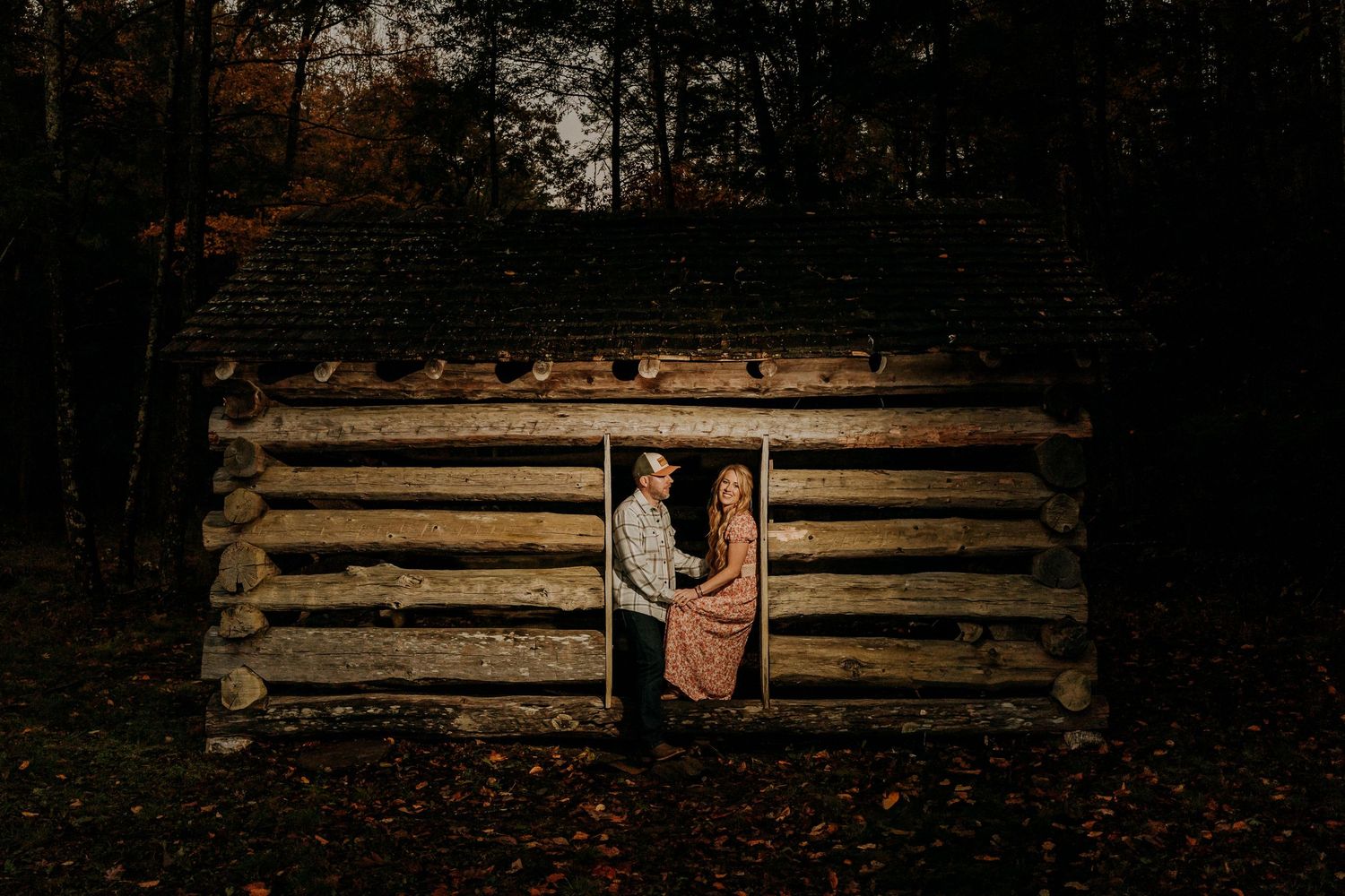 Engagement portraits in Cades Cove with scenic Smoky Mountain views.